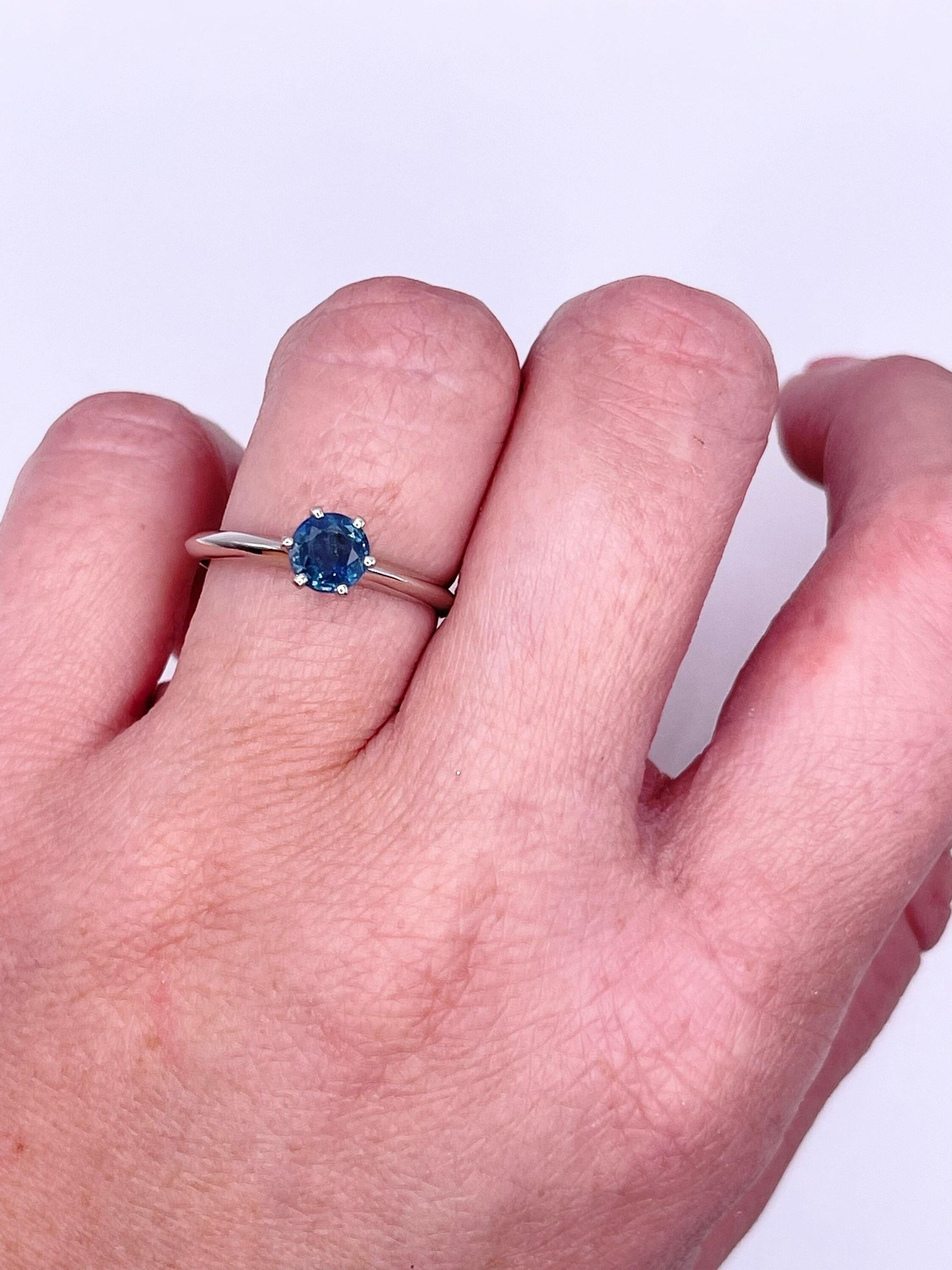 Elegant and modern piece two in one, 6 claw prong design makes the ring so royal and classy, the slick shank and crown design make it modern. The ring is made with 1 ct blue sapphire in 18KT white gold.

 Will come with a certificate of authenticity
