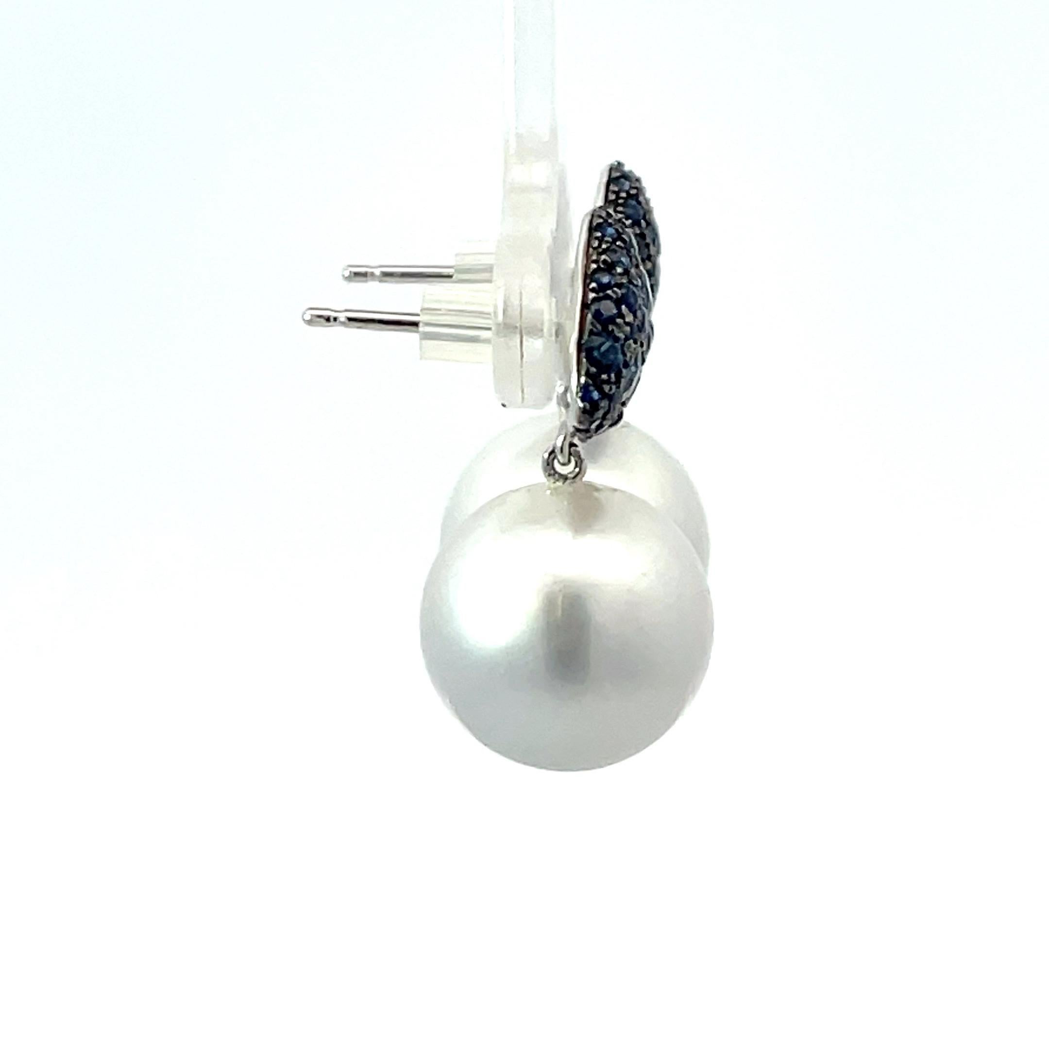18 Karat White Gold drop earrings featuring two South Sea Pearls measuring 12-13 MM and 76 blue Sapphires weighing 1.33 Carats.
Pearls earrings can be changed to Tahitian, Pink, Gold or South Sea
DM for more videos and pictures on my ear. 
Search
