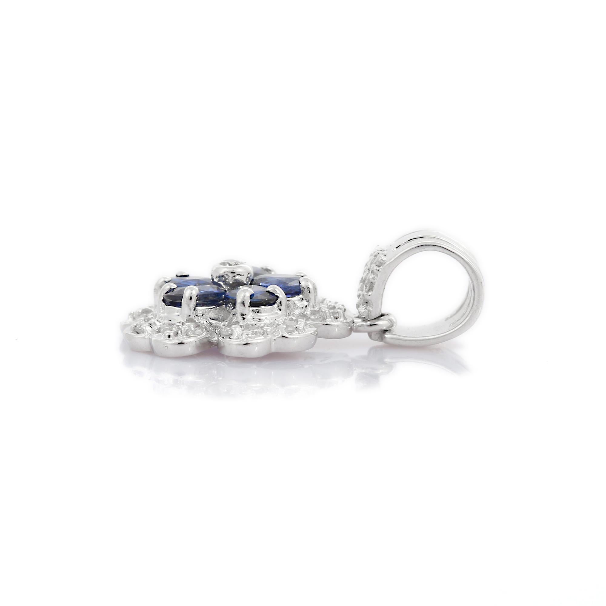 Oval Cut Designer Blue Sapphire Flower Pendant in 18K White Gold with Clustered Diamonds For Sale