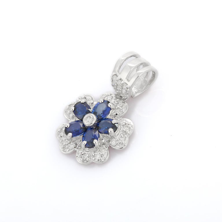 Blue Sapphire Flower Studs in White Gold main image 1