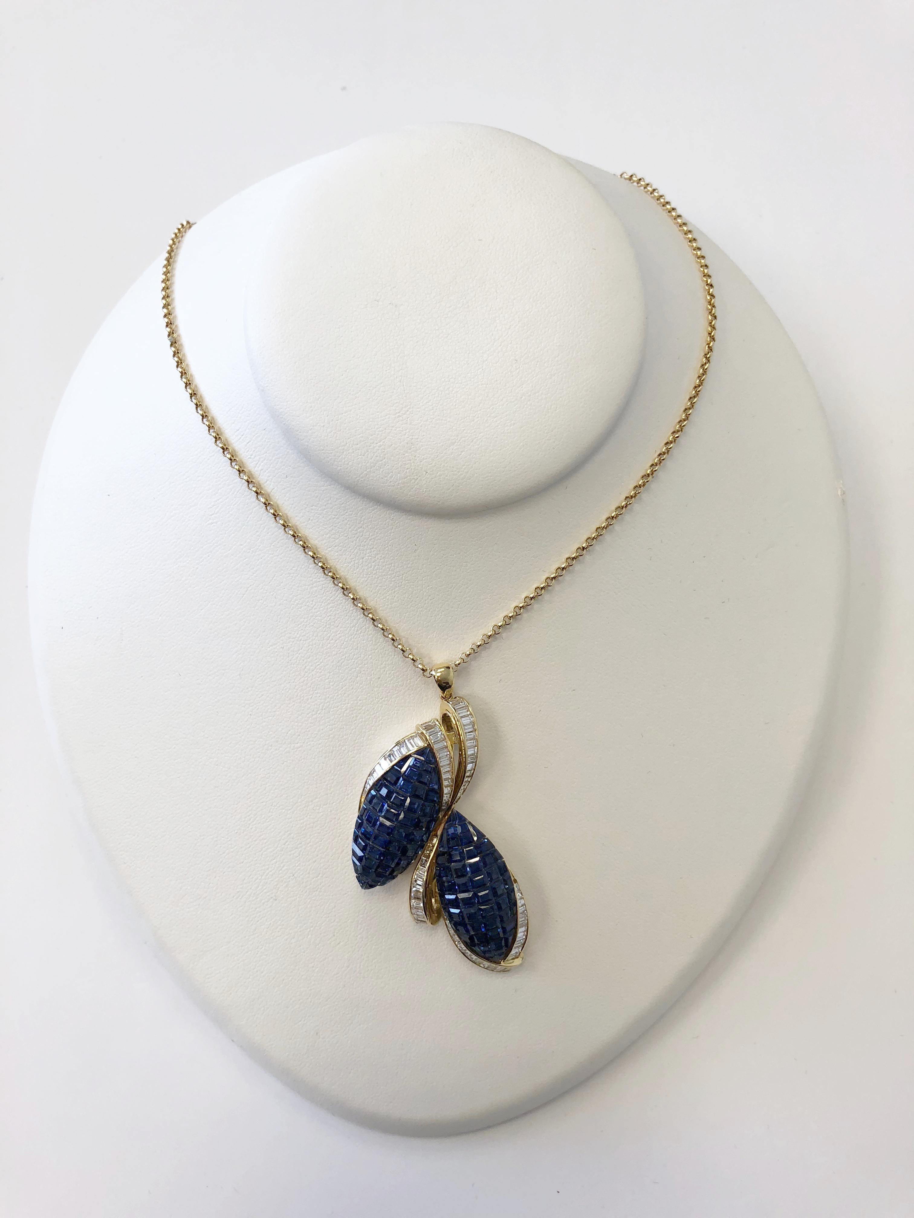 Beautiful blue sapphire squares channel set into a leaf design with diamonds in 18k yellow gold. Blue sapphires are 14.24 carats with a deep blue color and good crystal. White diamonds are 2.86 carats white and clean. Total length of necklace is