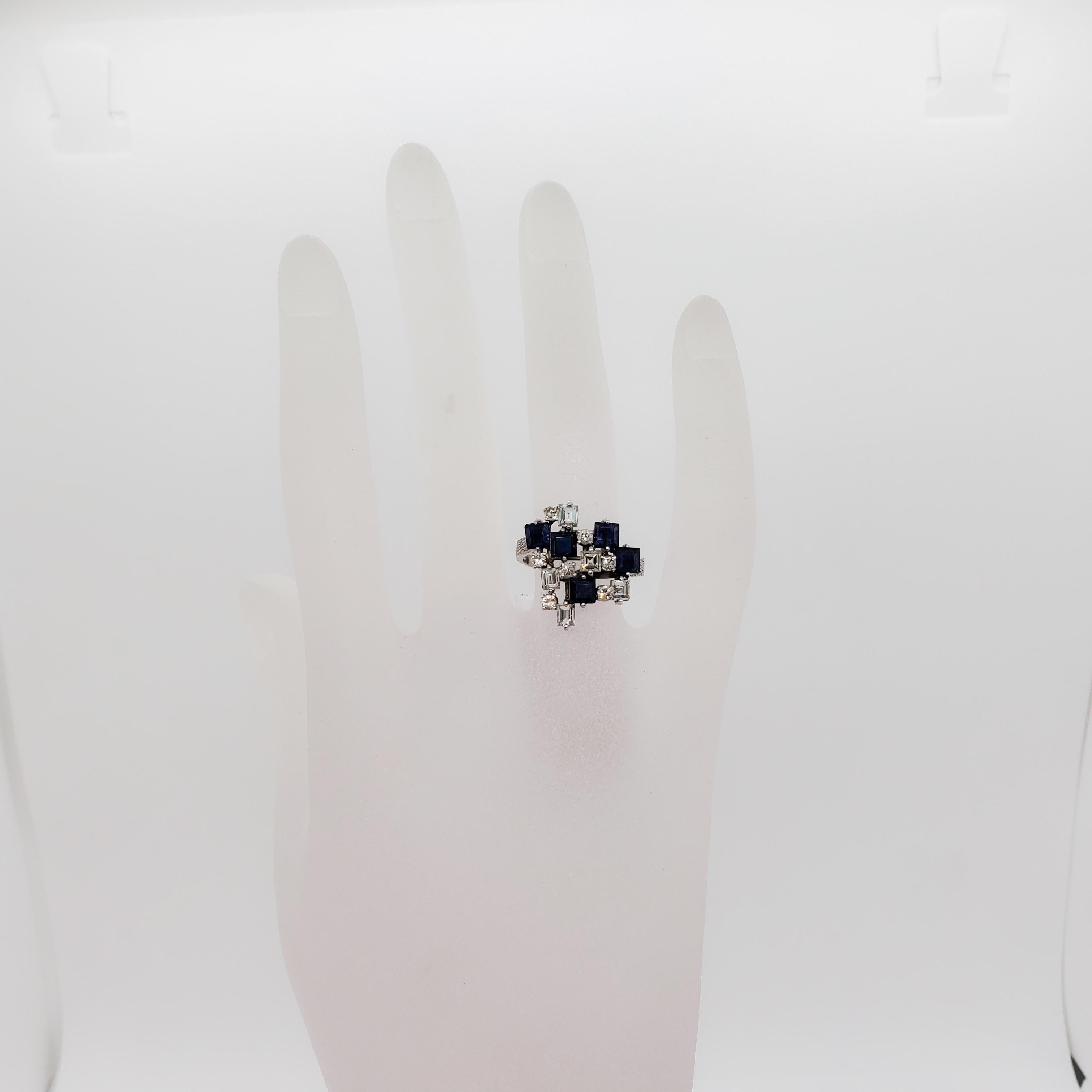 Fun and spunky platinum ring featuring 1.73 ct. of dark blue sapphire squares with 1.00 ct. of good quality white diamond rounds. Handmade mounting in size 7.25. Perfect for everyday or a special occasion.