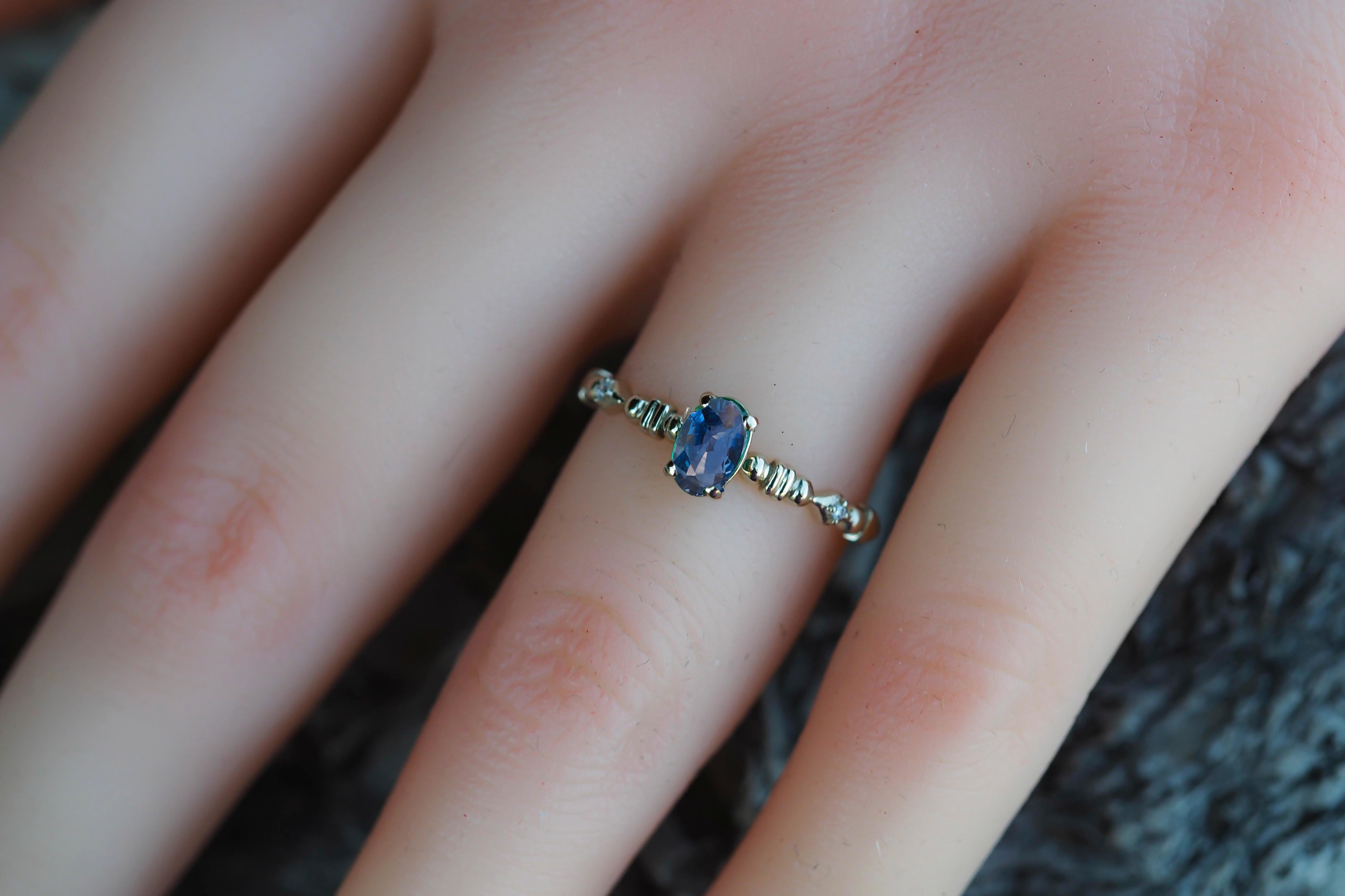 Blue sapphire stackable ring. 

Sapphire 14k gold ring. Minimalist 14k gold ring. September birthstone ring. Sapphire Stacking Ring.
 
Metal: 14kt solid gold
Weight: 1.8 gr depends from size.

Central gemstone: Natural Sapphire
Color: blue
Oval cut,