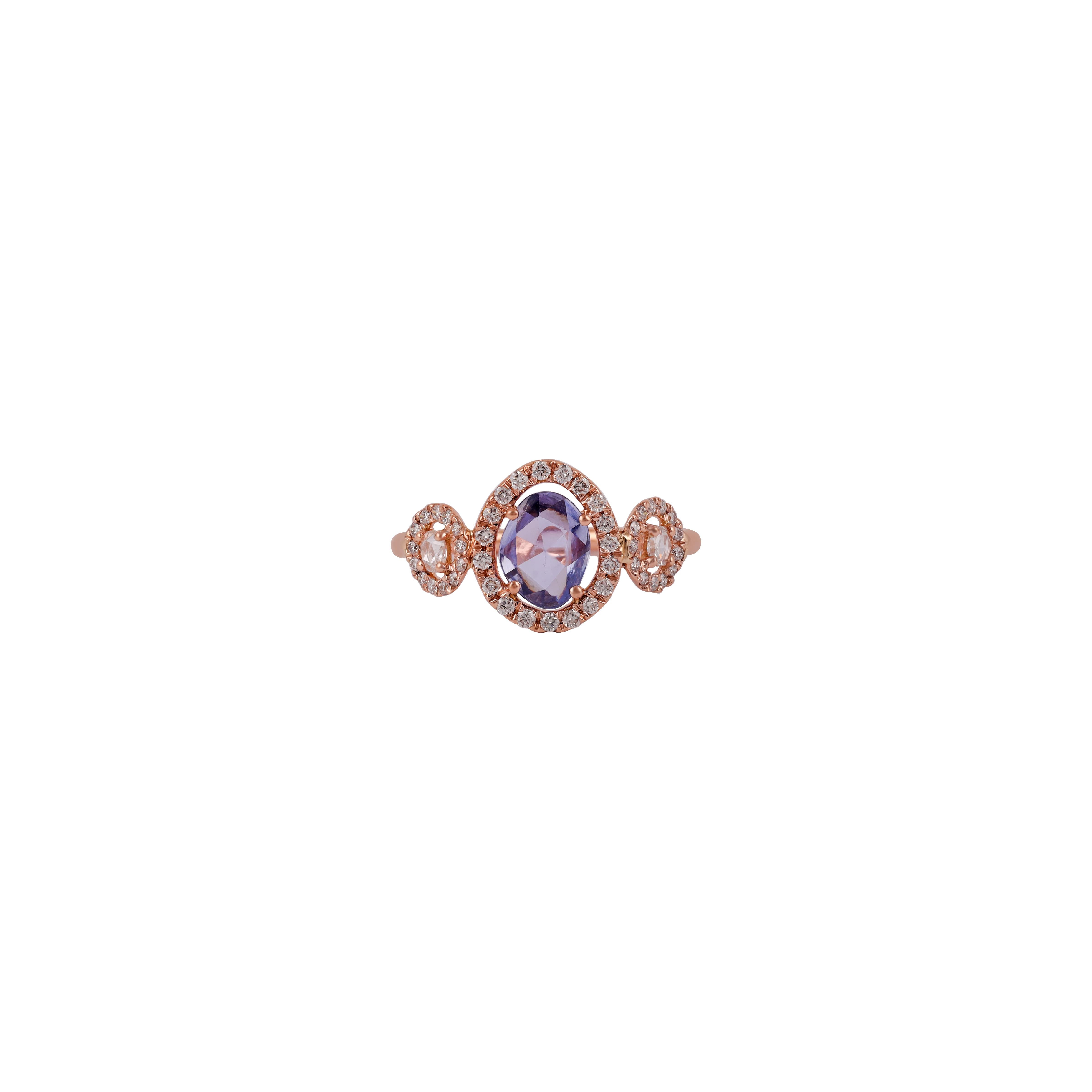 Blue Sapphire surrounded by brilliant round cut Diamond Ring 
1 Uneven shape Sapphire 0.90 CTS
 Both side 2  Rose cut  Diamonds 0.10 CTS
45 Round brilliant cut diamonds 0.29 CTS
18 k Rose gold mounting 2.13 GMS


Custom Services
Resizing is