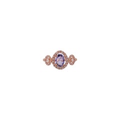 Blue Sapphire Surrounded by Round Brilliant Cut Diamond Ring