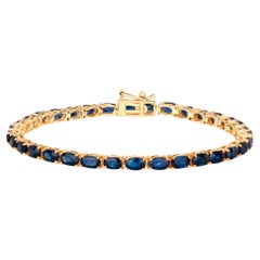 Bracelet tennis en or jaune 14 carats avec saphir bleu 7,50 carats