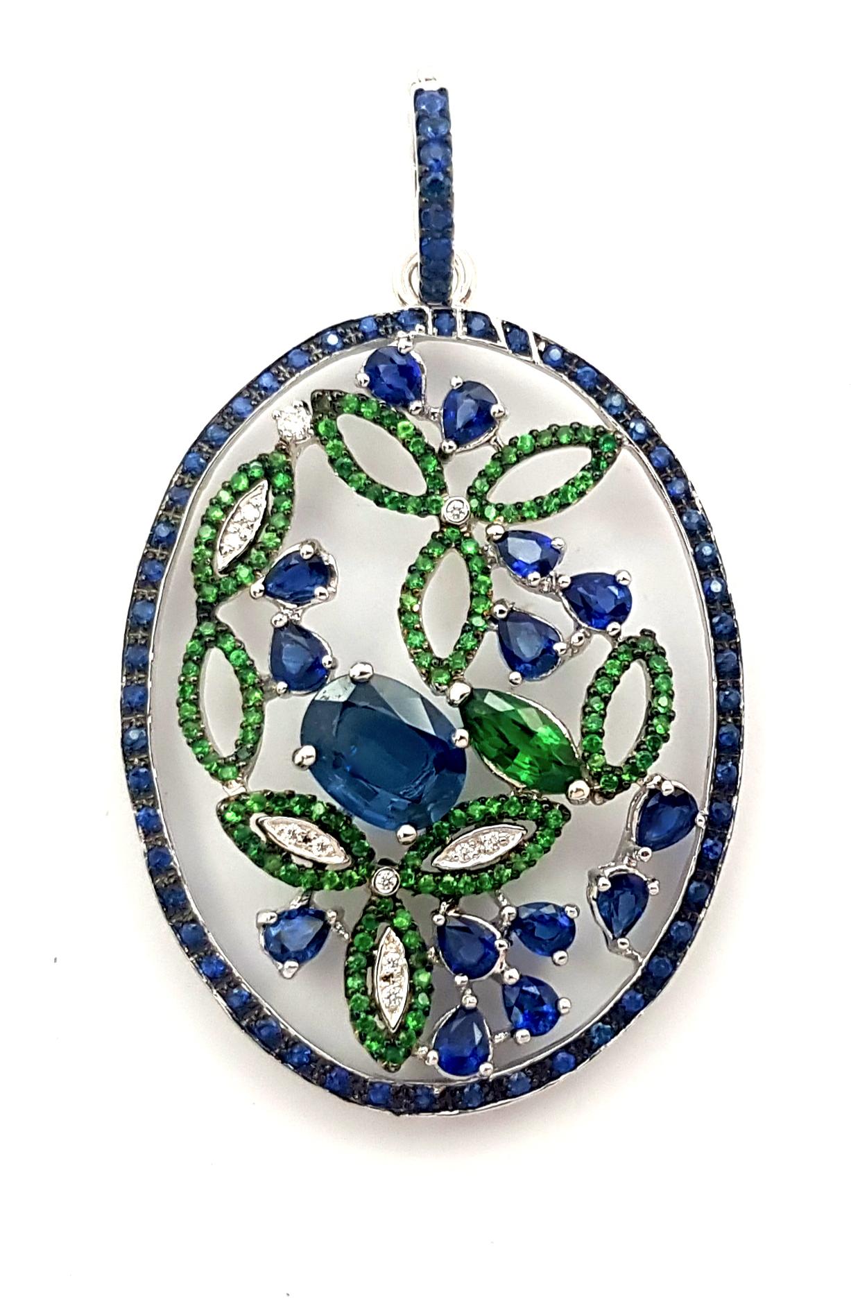 Blue Sapphire 6.07 carats, Tsavorite 1.63 carats and Diamond 0.08 carat Pendant set in 18K White Gold Settings
(chain not included)

Width: 3.5 cm 
Length: 5.7  cm
Total Weight: 15.26 grams

