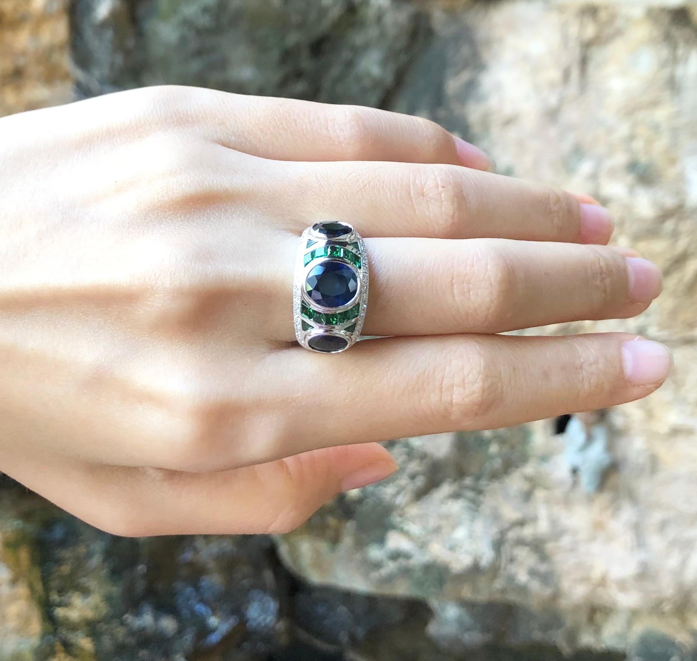 Blue Sapphire 2.83 carats, Blue Sapphire 2.03 carats, Tsavorite 1.21 carats and Diamond 0.30 carat Ring set in 18 Karat White Gold Settings

Width:  2.3 cm 
Length: 1.2 cm
Ring Size: 54
Total Weight: 11.42 grams


