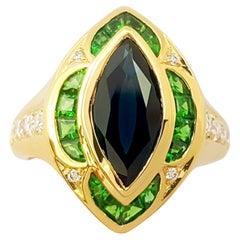 Ring mit blauem Saphir, Tsavorit und Diamant in 18 Karat Goldfassungen gefasst