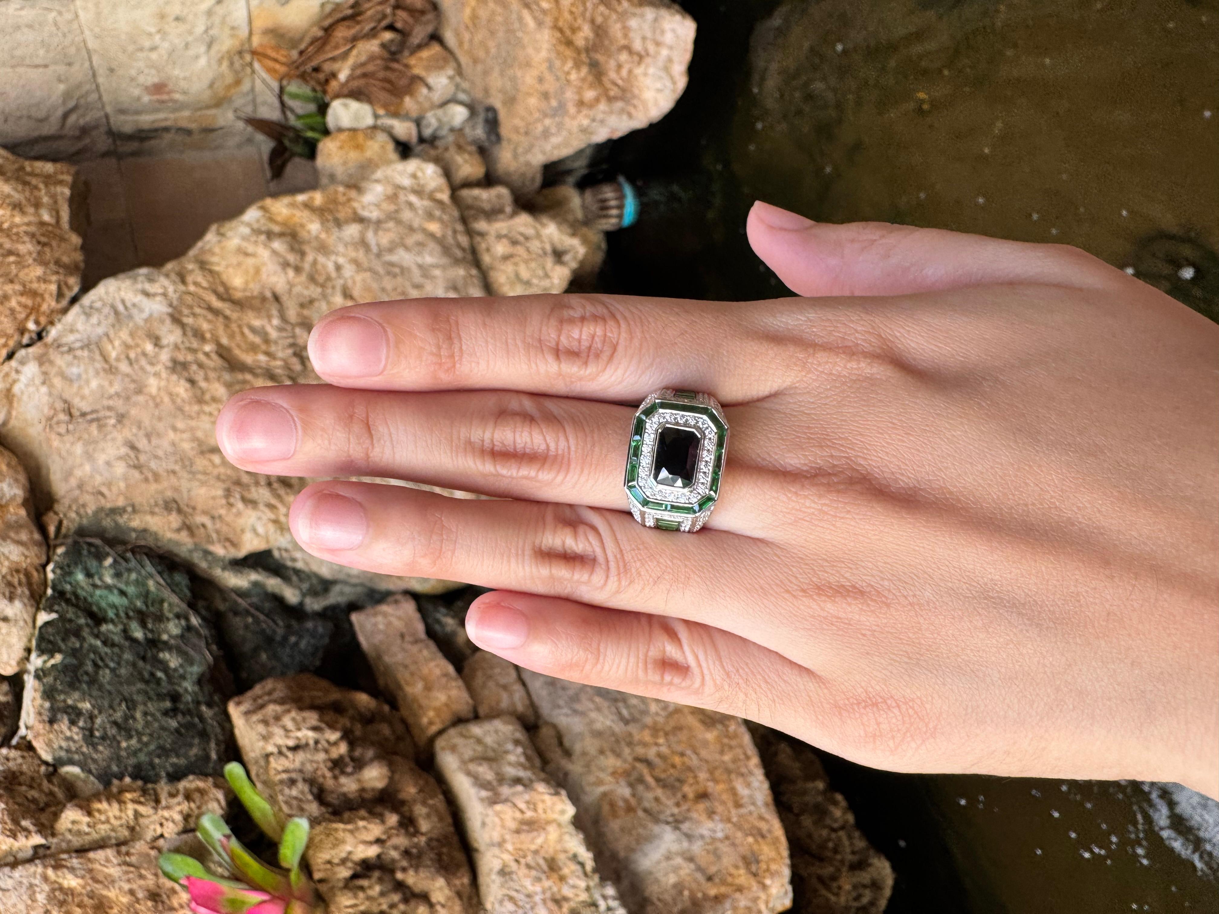 Blue Sapphire1.76 carats, Tsavorite 2.79 carats and Diamond 1.09 carats Ring set in 18K White Gold Settings

Width:  1.6 cm 
Length: 1.4 cm
Ring Size: 59
Total Weight: 12.68 grams

