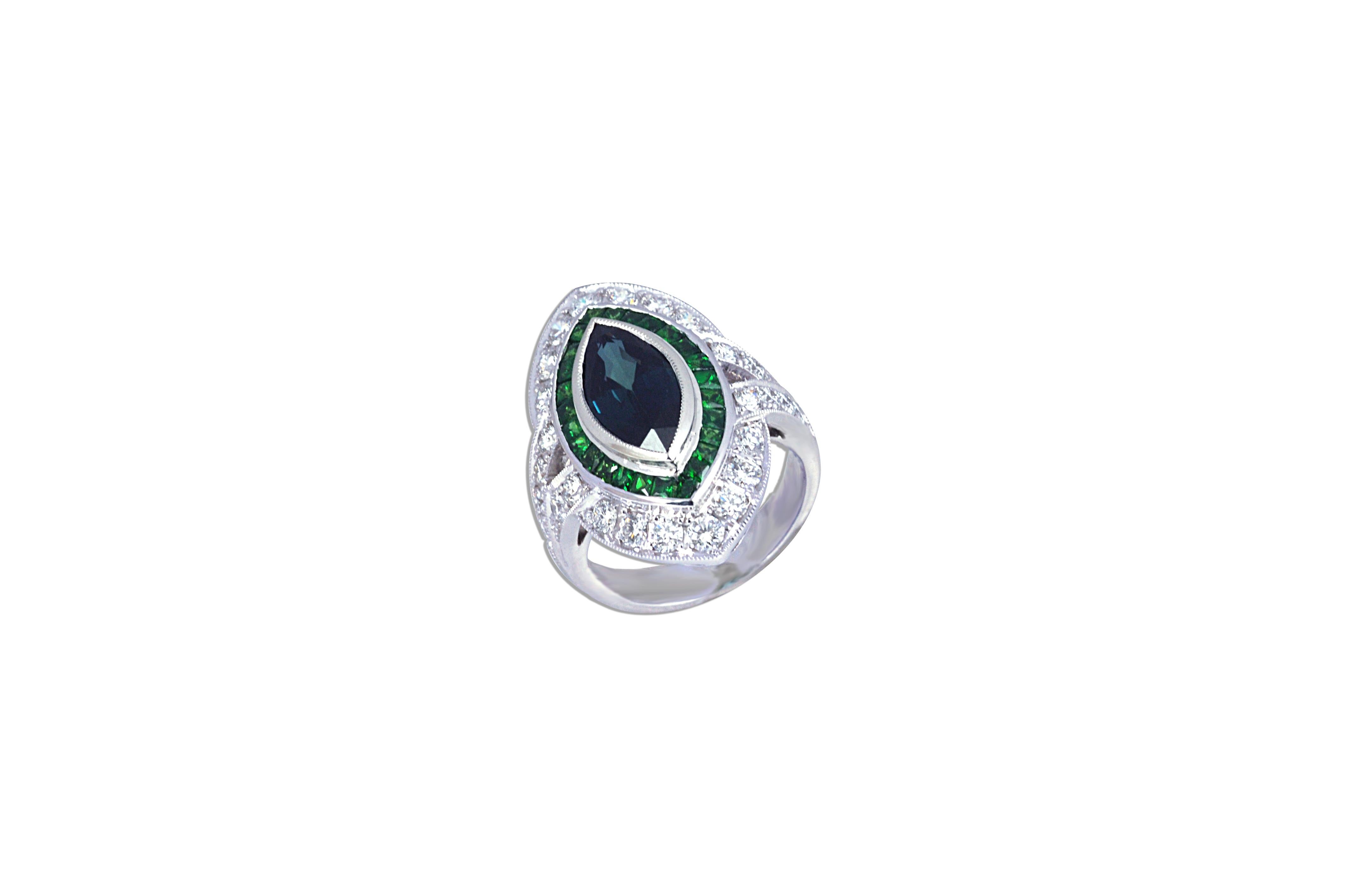  This Art deco inspired ring is centered with a bezel-set marquise shaped blue Sapphire, surrounded by  Tsavorites 0.92 carat and round brilliant-cut Diamond 1.24 carats set in 18 karat White Gold. 
 
The ring is currently a size 52 (6 1/4 US) ,