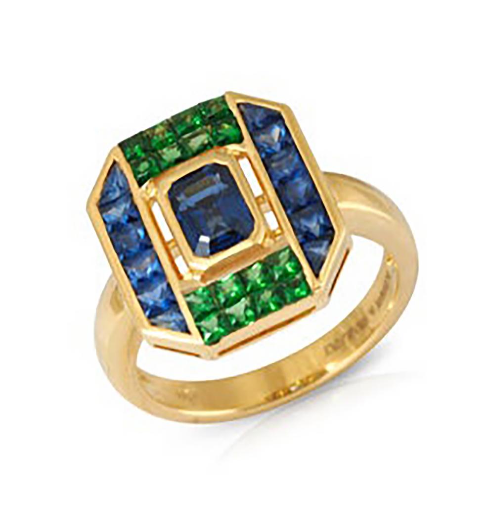 Blue Sapphire 1.34 carats with Tsavorite 0.65 carat and Blue Sapphire 0.79 carat Ring set in 18 Karat Gold Settings

Width:  1.4 cm 
Length:  1.5 cm
Ring Size: 52
Total Weight: 5.77 grams

Uncompromisingly modern and exuding, the collection draws
