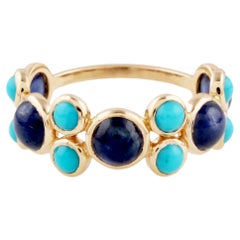 Anillo redondo de zafiro azul y turquesa en oro amarillo de 18 quilates