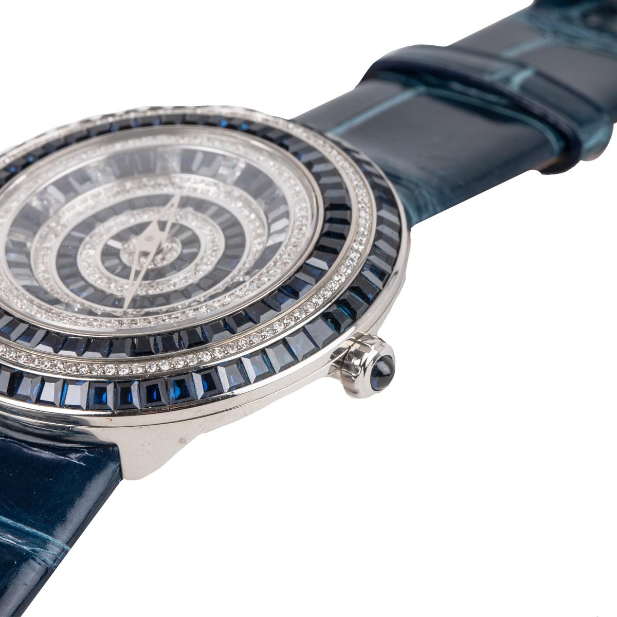 This watch features blue sapphires in baguette shape and diamonds embedded on the face of the watch. This watch features automatic movement and is made with stainless steel and fine leather.