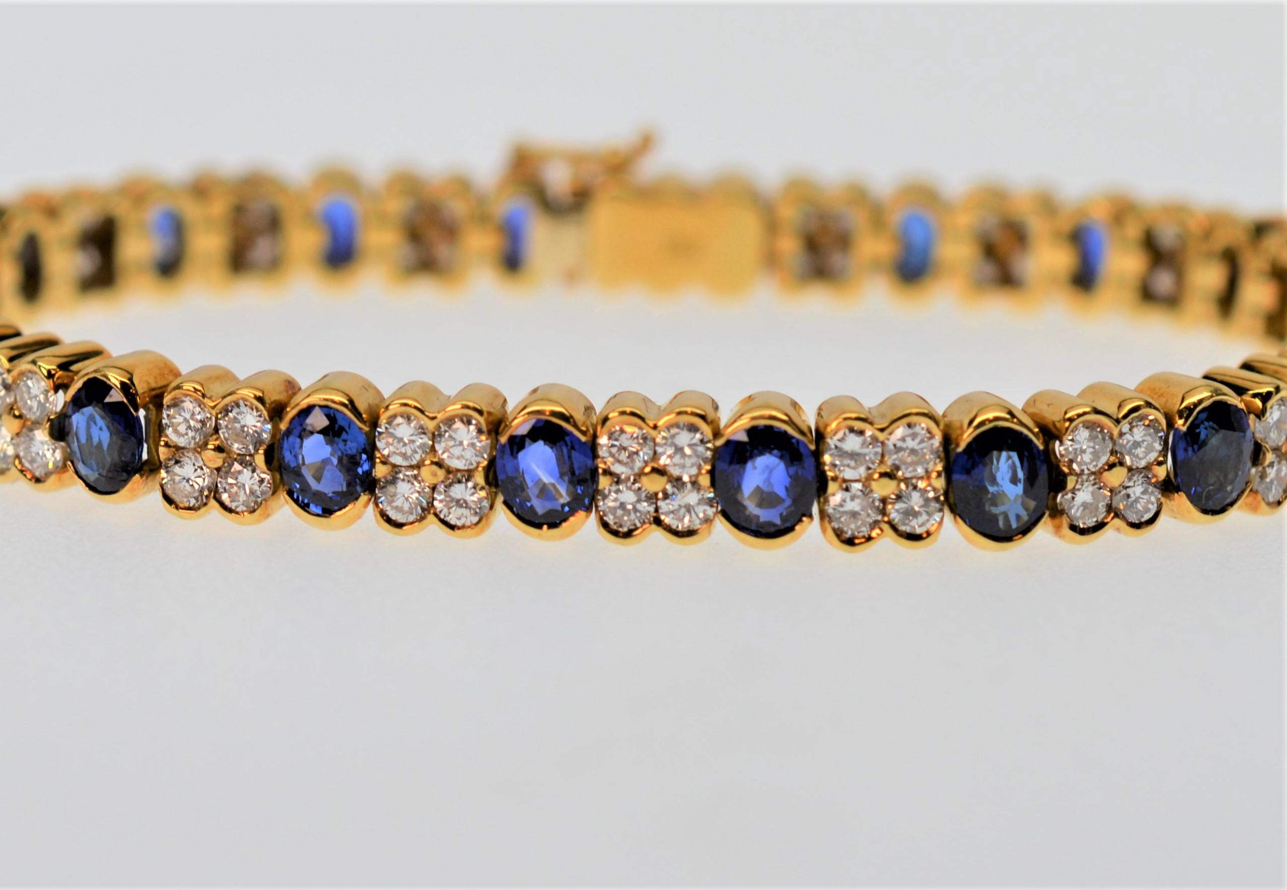 Sensational Blue Sapphire & Bright White Diamond 18K Yellow Gold Bracelet.
An finely constructed estate piece, but essentially new, this glamorous seven inch bracelet is crafted with twenty intense Blue Sapphires, 6.0 cts. total weight and eighty