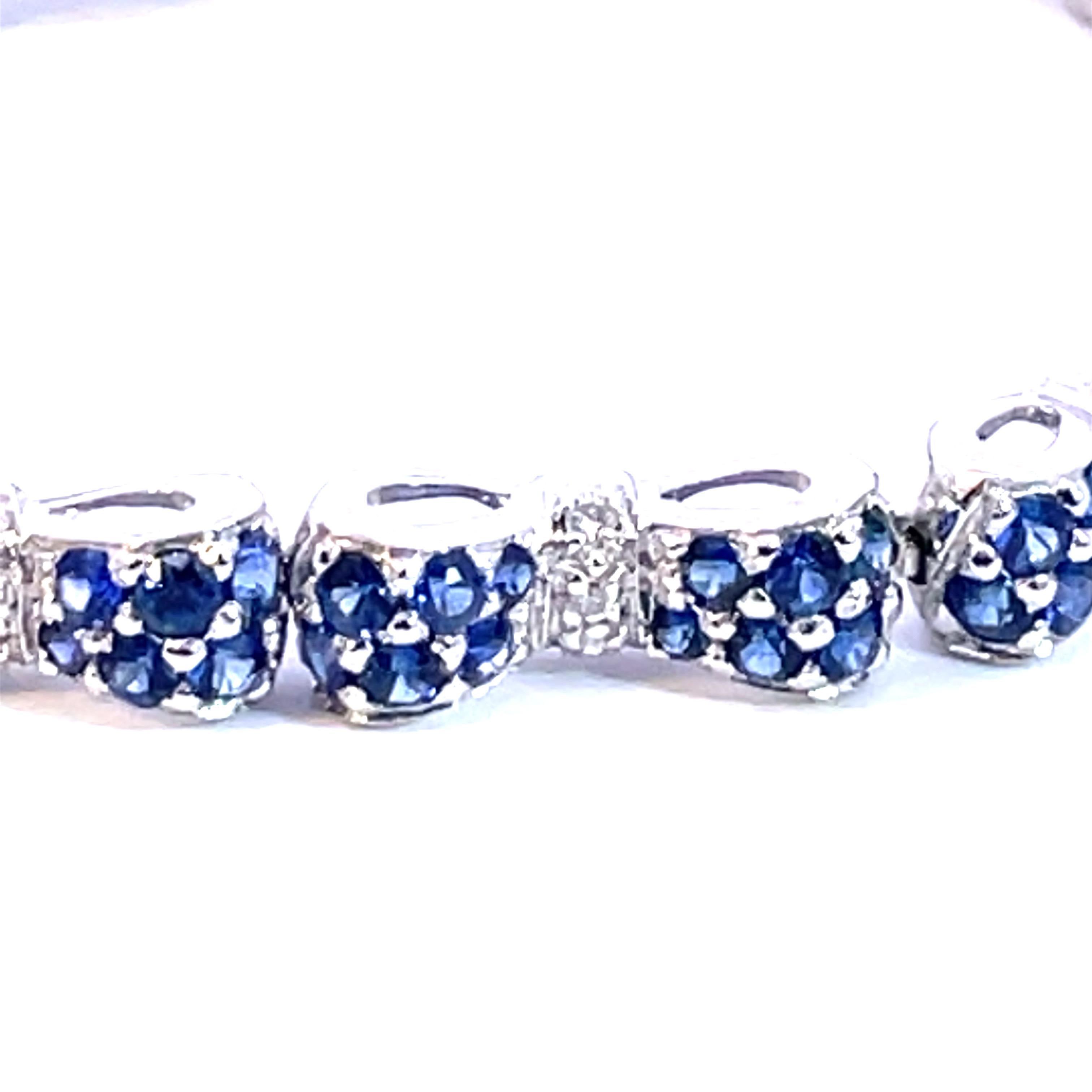 An Beautiful Bow Tie Bracelet set with natural blue sapphires and natural white diamonds in 18kt white gold.

144 natural  blue sapphires weighing 6.00ct total weight

36 natural white diamonds weighing 0.30ct total weight

18kt white gold, 18