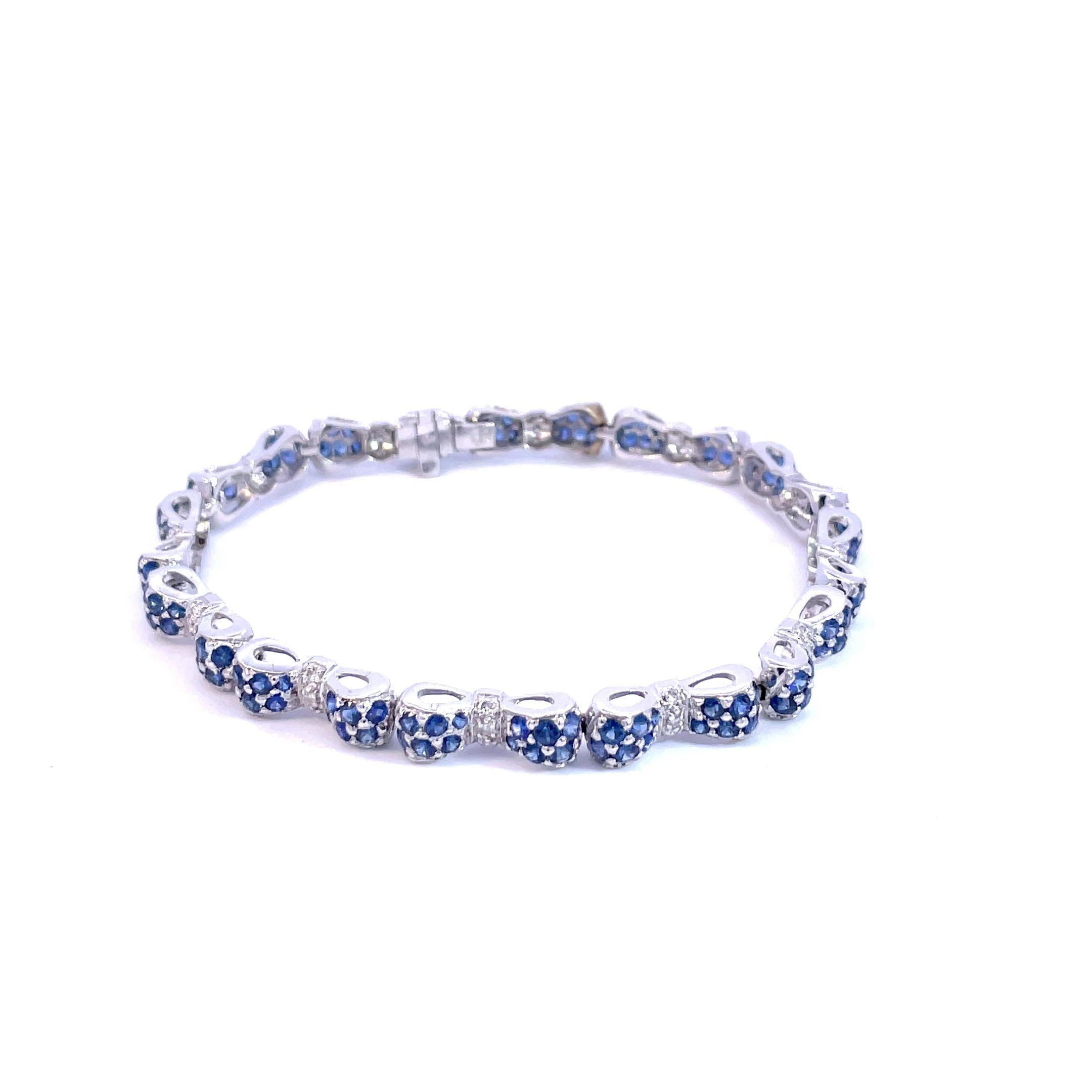 Round Cut Blue Sapphire & White Diamond Bow Tie Bracelet in 18 Karat White Gold  For Sale
