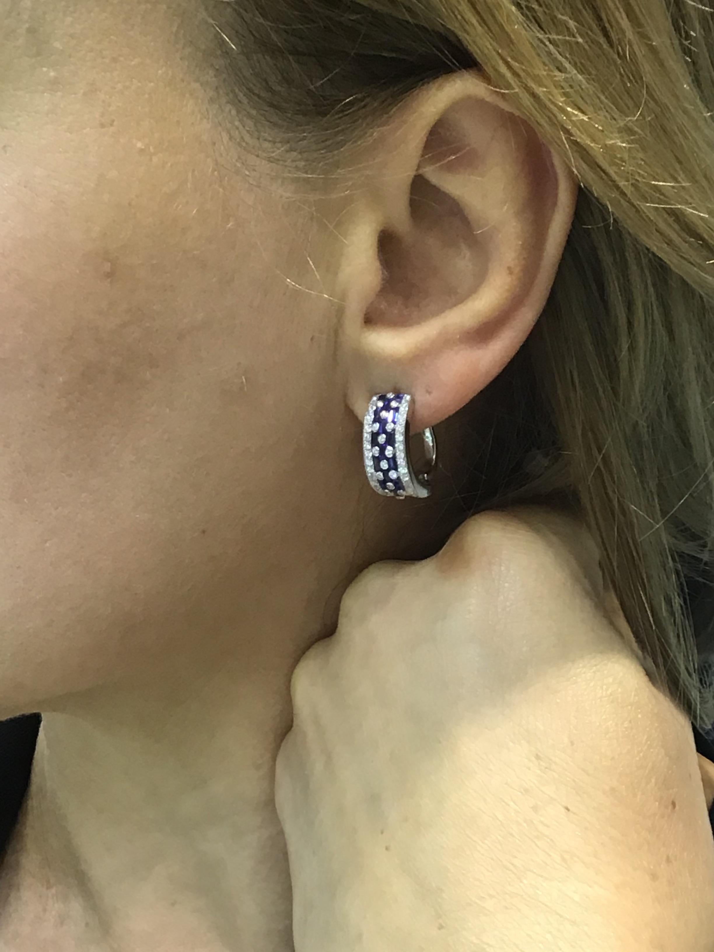 Earrings White Gold 14 K (Matching Ring Available)
Diamond 92-Round 57-0,57-4/4A
Blue Sapphire 2-21-0,08 (4)/2A
Blue Sapphire 26-Round-1,82 (5)/3
Weight 6.34 grams

With a heritage of ancient fine Swiss jewelry traditions, NATKINA is a Geneva based