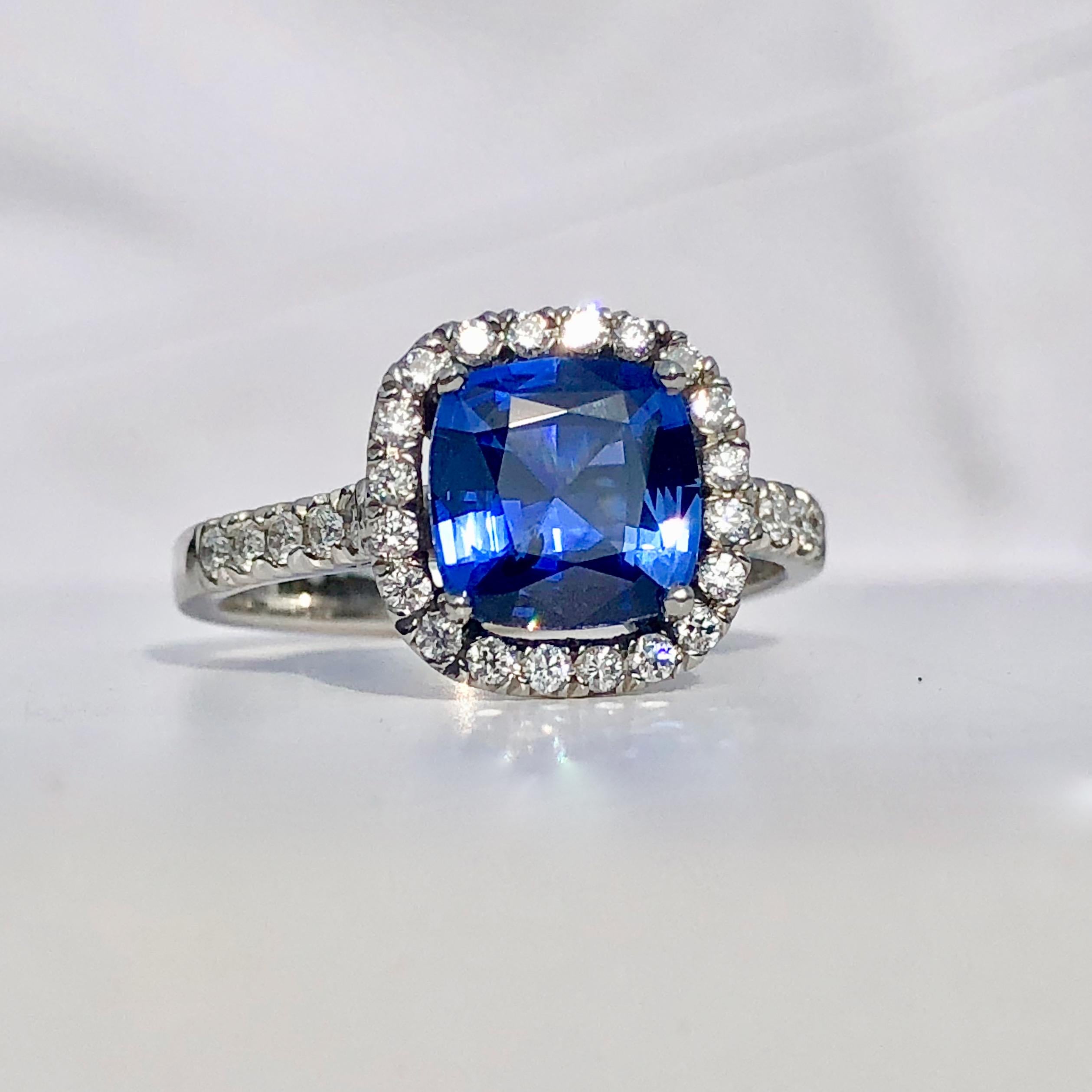 Contemporary Blue Sapphire White Diamond Platinum Engagement Round Brilliant Cut Halo Ring