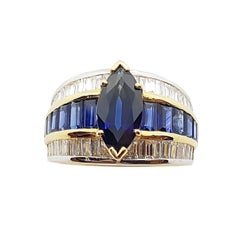 Bague en or 18 carats sertie d'un saphir bleu et d'un diamant et d'un saphir bleu