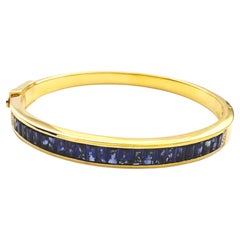 Blue Sapphire with Diamond Bangle set in 18K Gold Setting