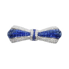 Blue Sapphire with Diamond Bow Brooch Set in 18 Karat White Settings