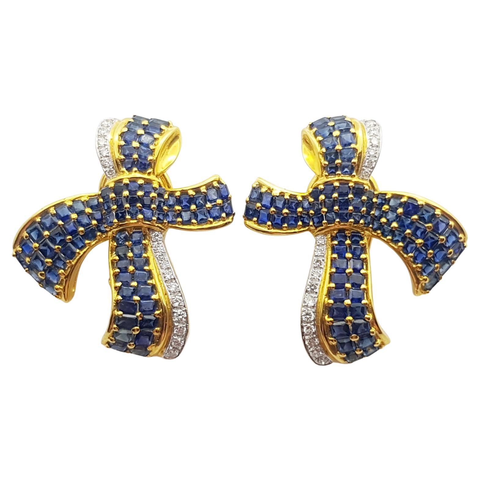 Boucles d'oreilles saphir bleu et diamant en forme d'arc serti dans une monture en or 18 carats