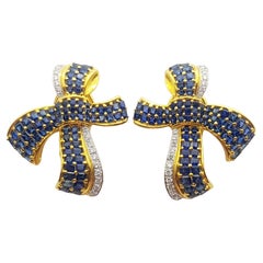 Blue Sapphire with Diamond Bow Earrings Set in 18k Gold Settings