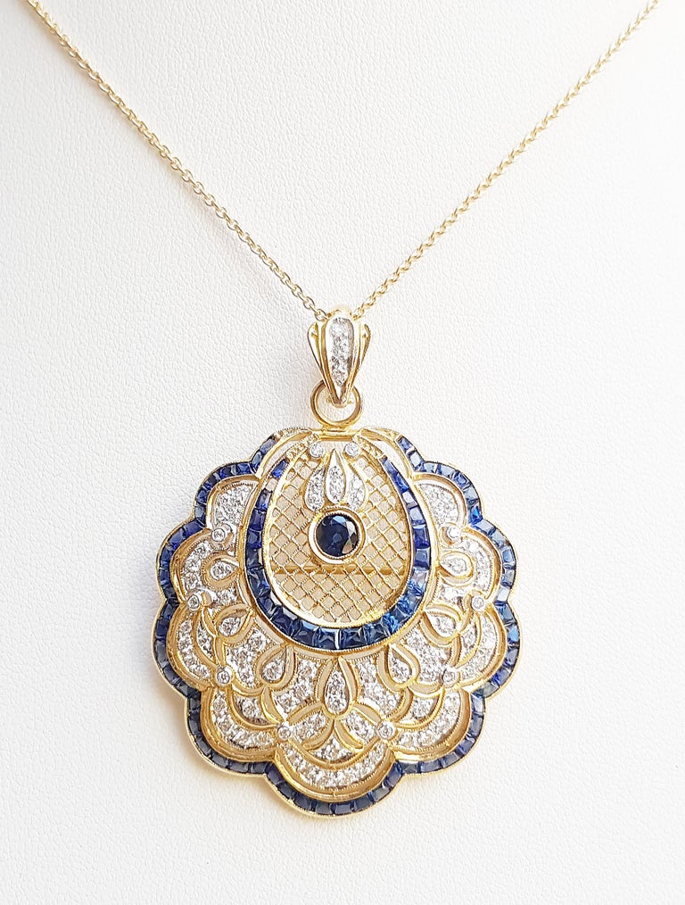 Blue Sapphire 8.61 carats with Diamond 1.31 carats Brooch/Pendant set in 18 Karat Gold Settings
(chain not included)

Width:  4.0 cm 
Length: 5.4 cm
Total Weight: 12.63 grams


