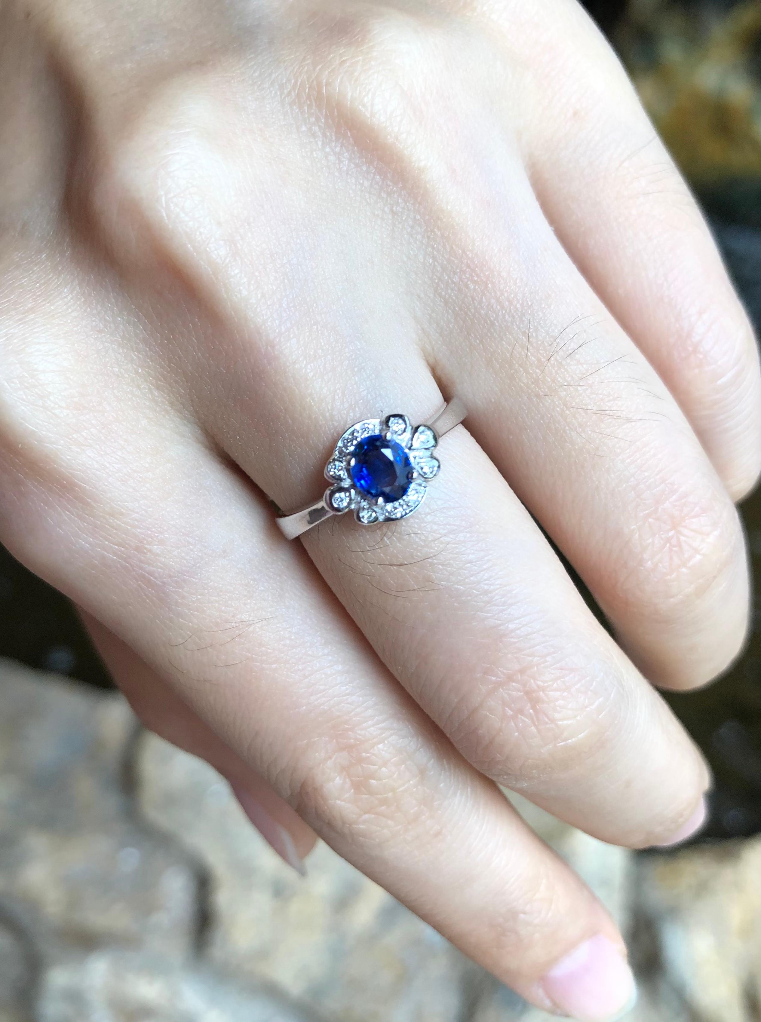 Oval Cut Blue Sapphire with Diamond Carat Ring Set in 18 Karat White Gold Settings For Sale