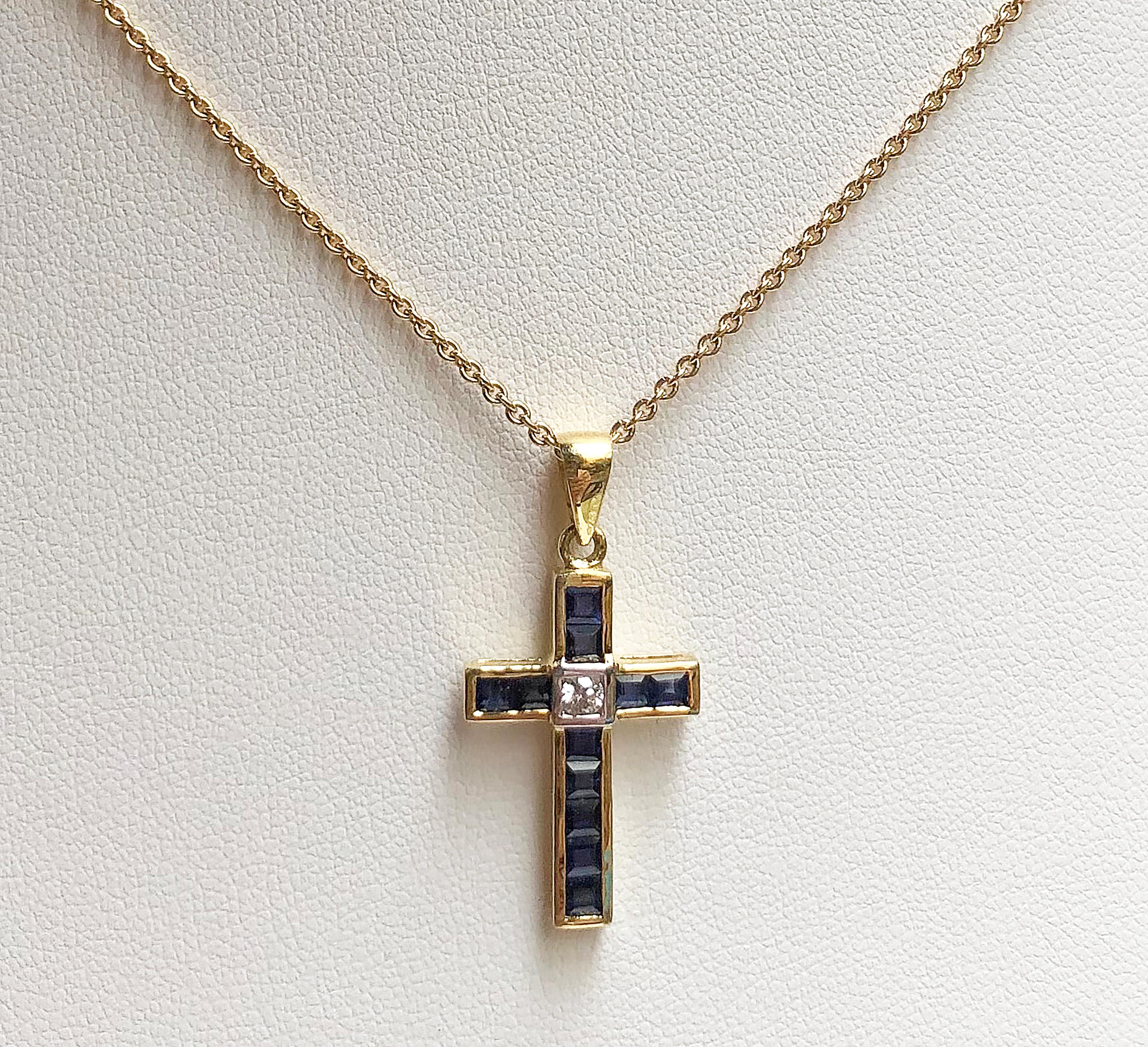 Blue Sapphire 1.23 carats with Diamond 0.07 carat Cross Pendant set in 18 Karat Gold Settings
(chain not included)

Width:  1.5 cm 
Length: 3.0 cm
Total Weight: 2.42 grams

