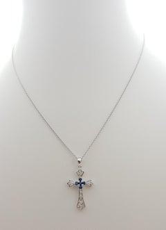 Blue Sapphire with Diamond Cross Pendant Set in 18 Karat White Gold Settings