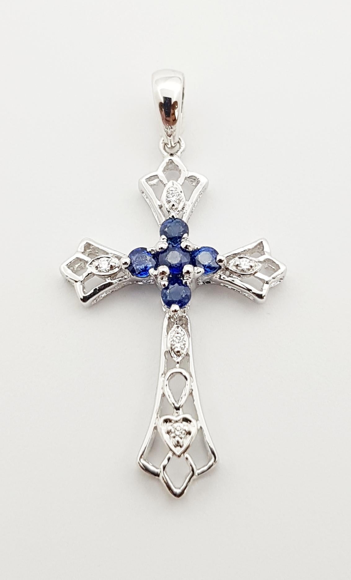 Contemporary Blue Sapphire with Diamond Cross Pendant Set in 18 Karat White Gold Settings For Sale