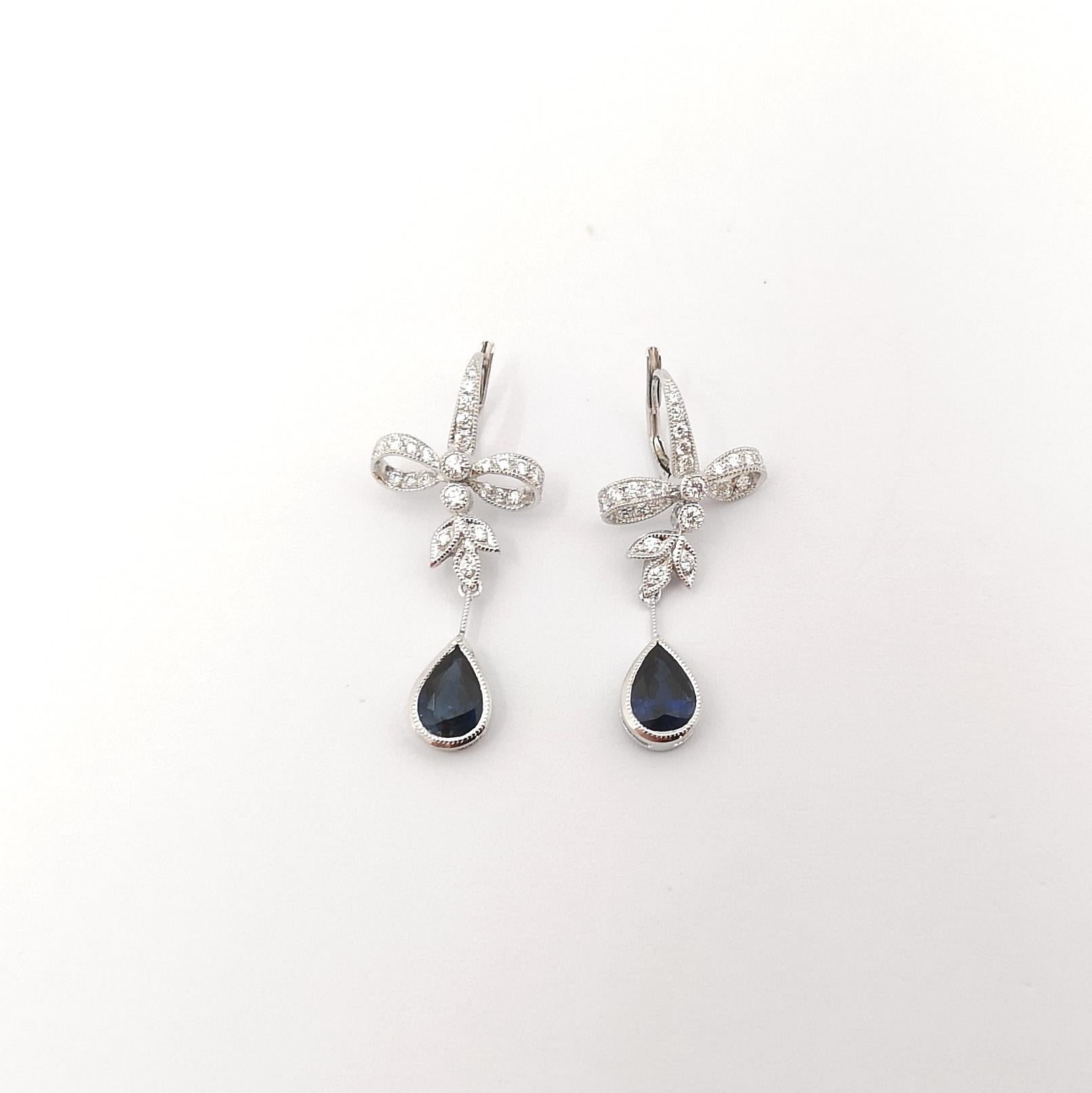 Pear Cut Blue Sapphire with Diamond Earring set in 18 Karat White Gold Settings For Sale