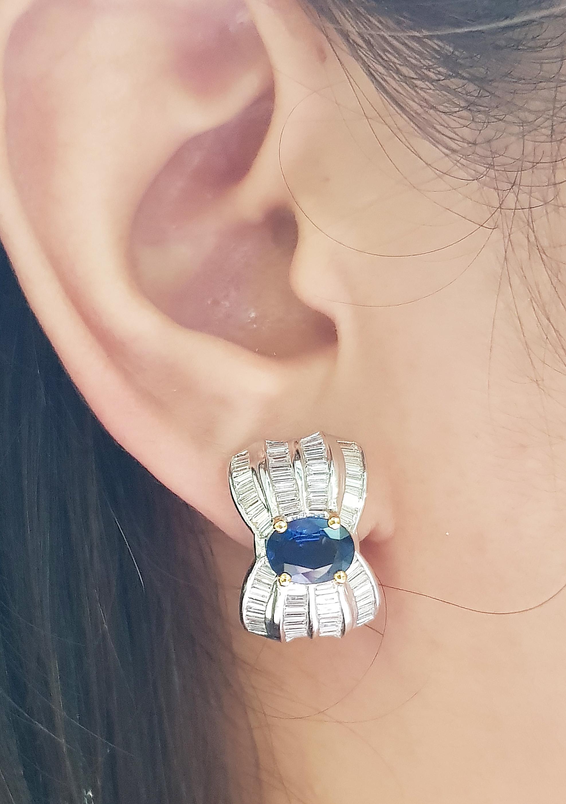 Blue Sapphire 2.64 carats with Diamond 2.70 carats Earrings set in 18 Karat Gold Settings

Width:  1.2 cm 
Length: 1.3 cm
Total Weight: 13.37 grams

