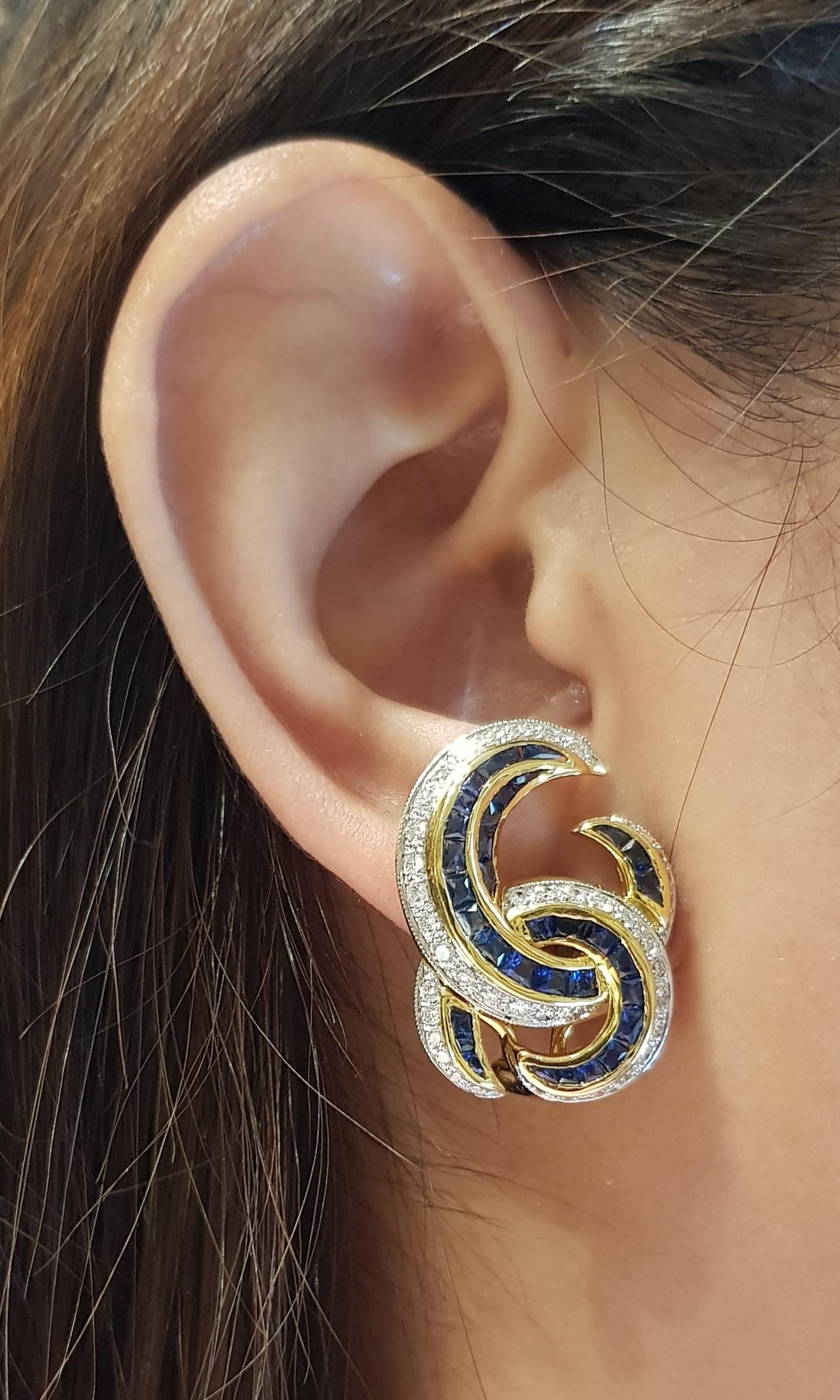Boucles d'oreilles composées d'un saphir bleu de 7,50 carats et d'un diamant de 1,04 carat sertis dans une monture en or 18 carats

Largeur :  2.1 cm 
Longueur : 2,7 cm
Poids total : 17,82 grammes

