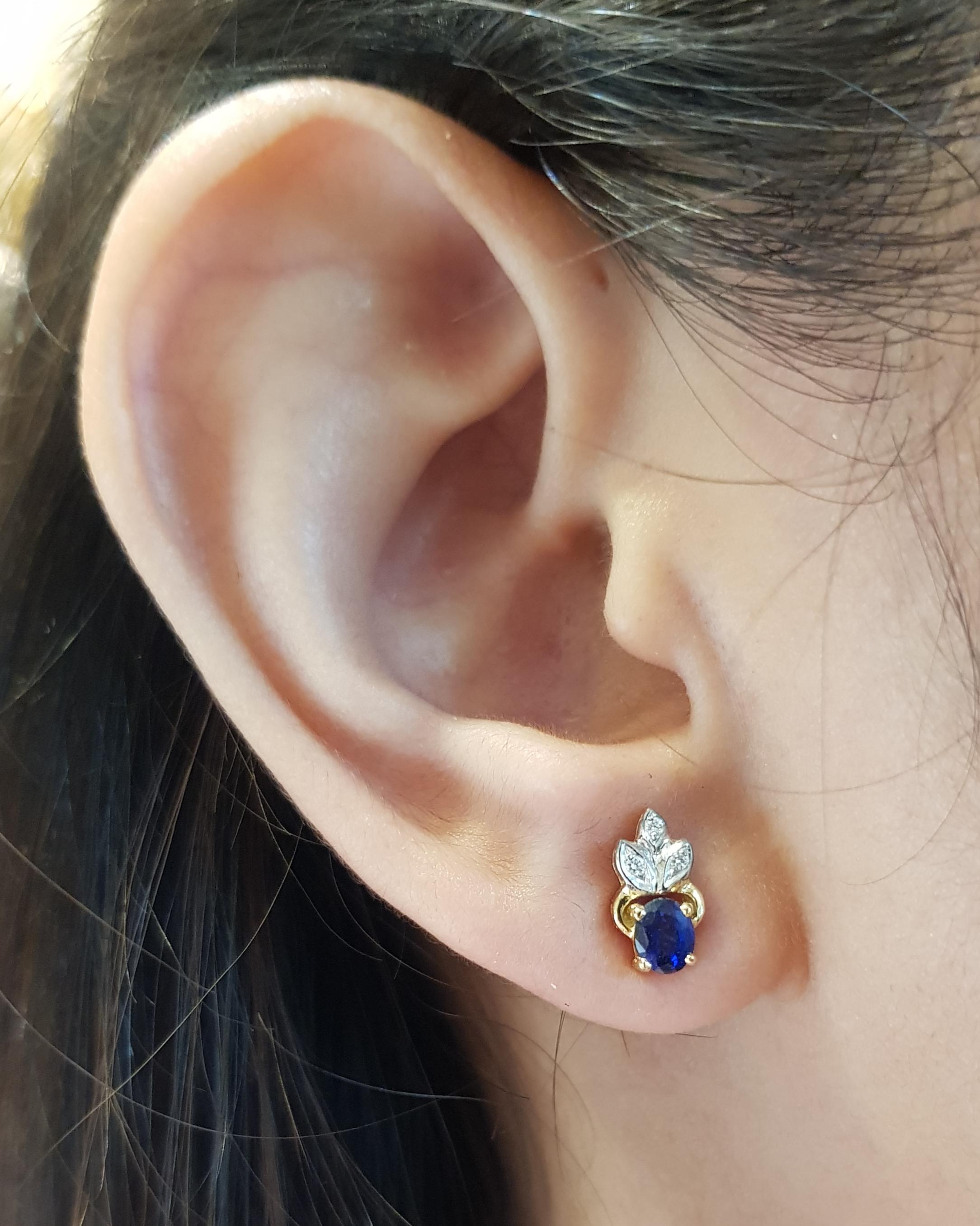 Blue Sapphire 0.65 carat with Diamond 0.04 carat Earrings set in 18 Karat Gold Settings

Width:  0.5 cm 
Length:  1.0 cm
Total Weight: 2.2 grams

