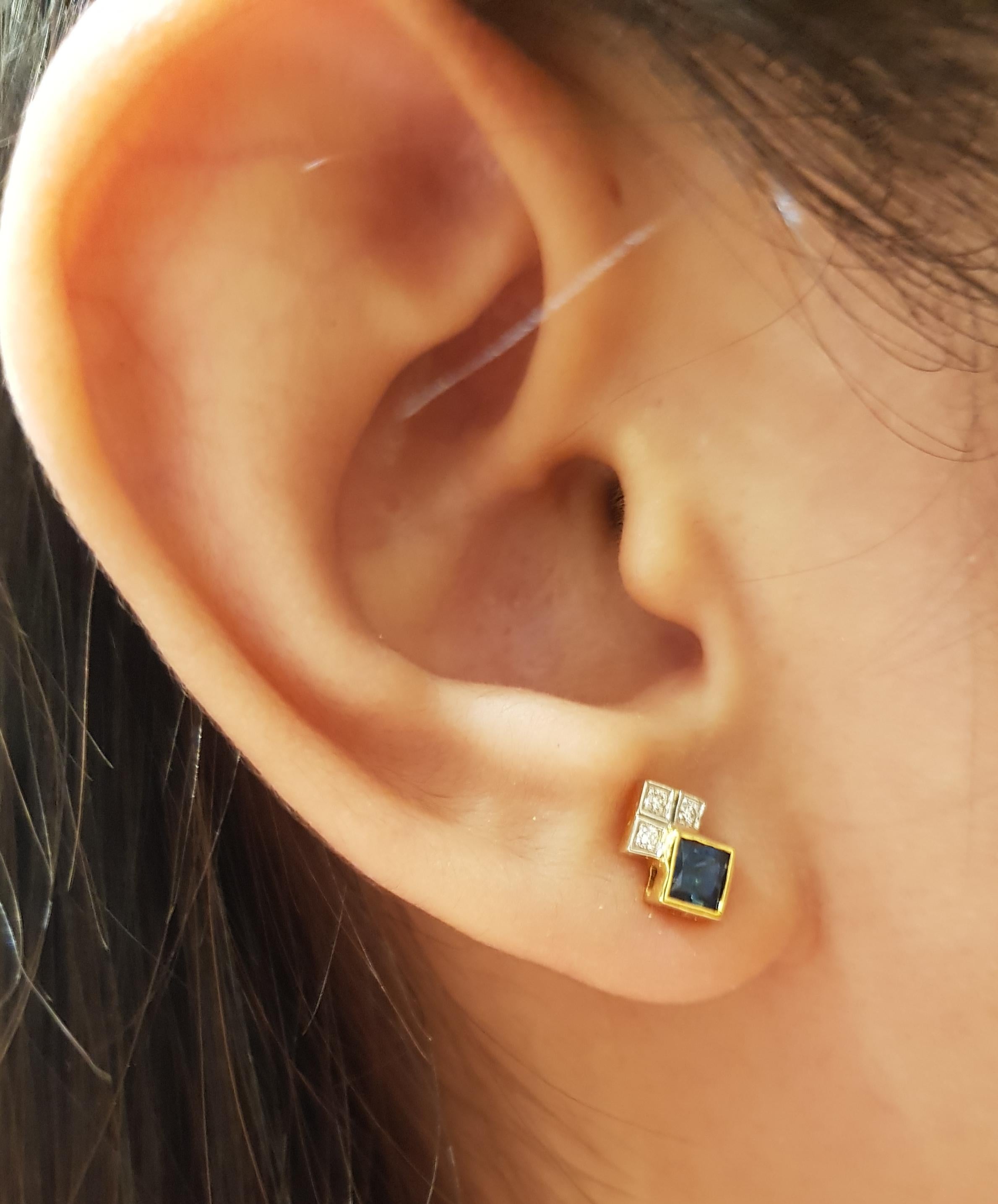 Blue Sapphire 0.60 carat with Diamond 0.05 carat Earrings set in 18 Karat Gold Settings

Width:  0.6 cm 
Length:  0.9 cm
Total Weight: 1.91 grams

