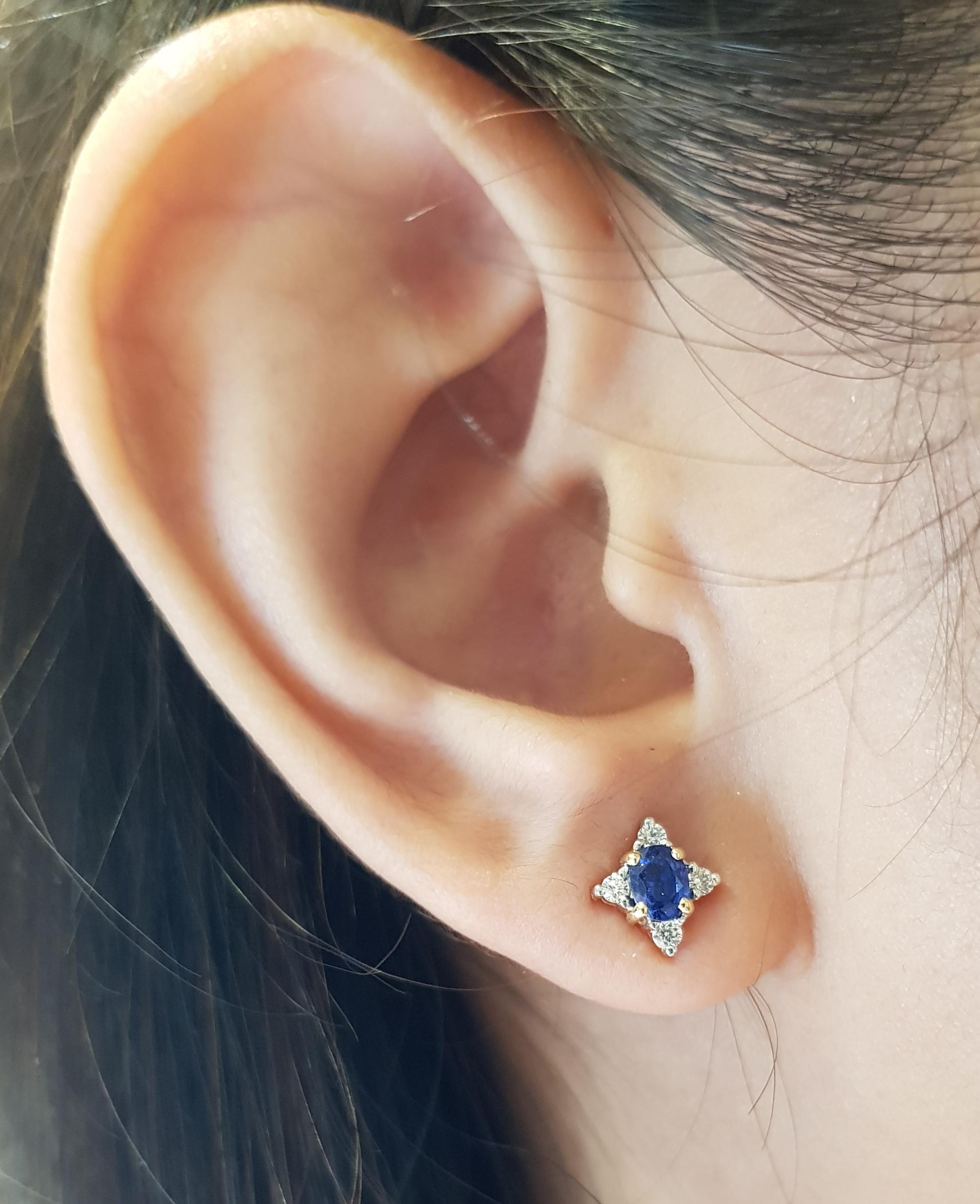 Blue Sapphire 0.70 carat with Diamond 0.15 carat Earrings set in 18 Karat Gold Settings

Width:  0.8 cm 
Length:  0.9 cm
Total Weight: 2.03 grams

