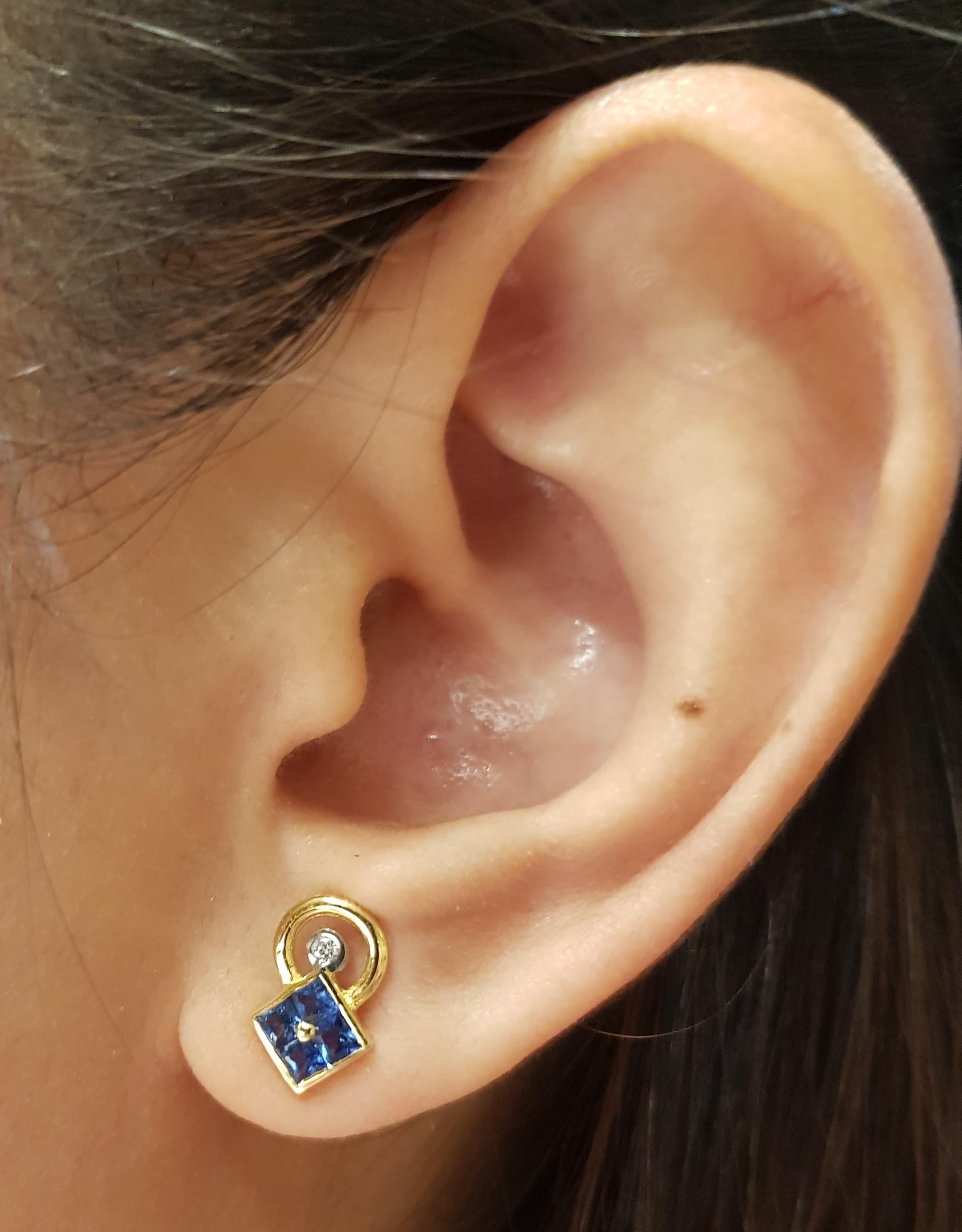 Blue Sapphire 0.75 carat with Diamond 0.04 carat Earrings set in 18 Karat Gold Settings

Width:  0.7 cm 
Length:  1.1 cm
Total Weight: 2.83 grams

