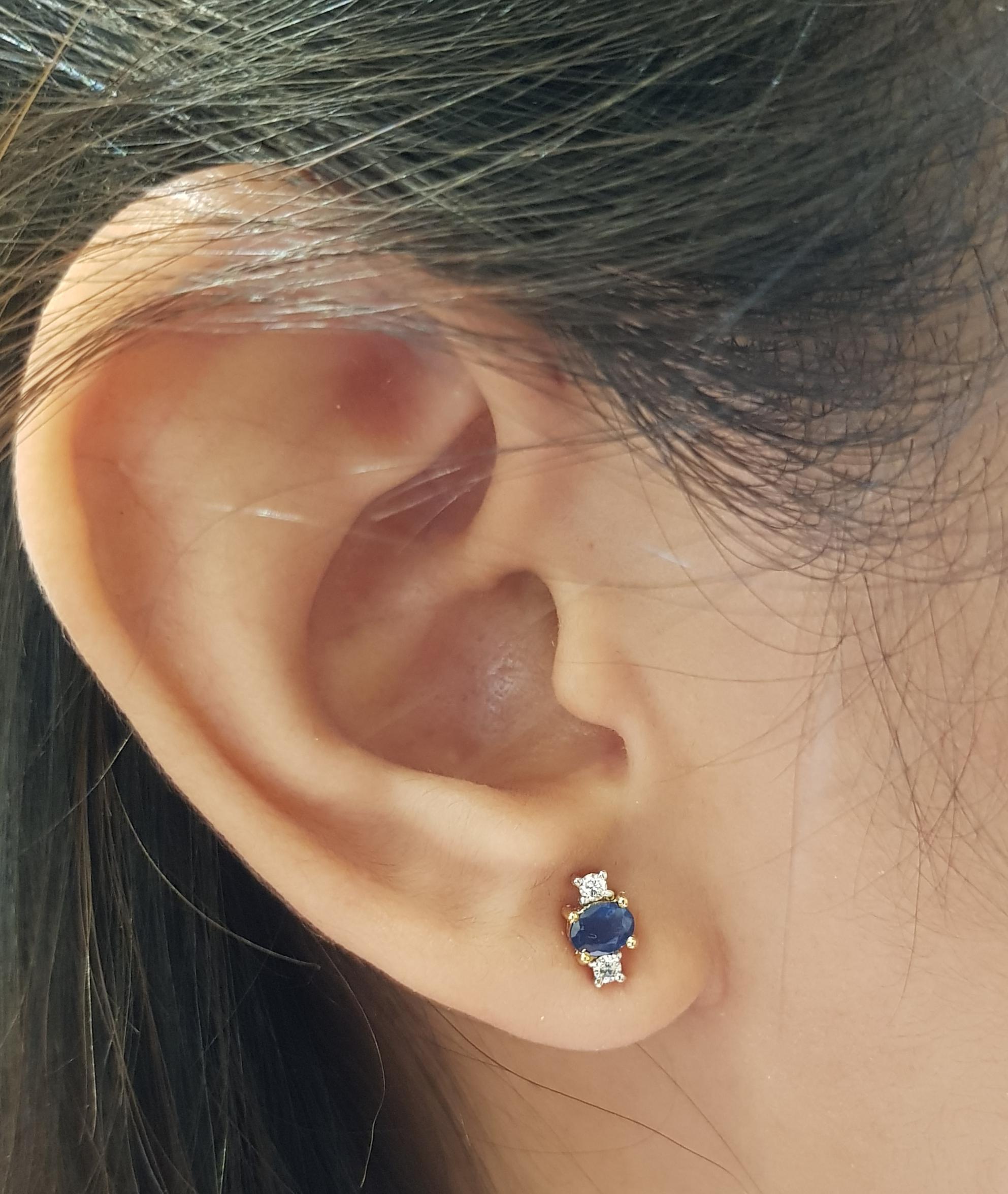 Blue Sapphire 0.68 carat with Diamond 0.09 carat Earrings set in 18 Karat Gold Settings

Width:  0.4 cm 
Length:  0.8 cm
Total Weight: 2.23 grams

