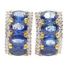 Boucles d'oreilles en or 18 carats serties de saphirs bleus et de diamants