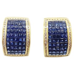 Boucles d'oreilles en or 18 carats serties de saphirs bleus et de diamants