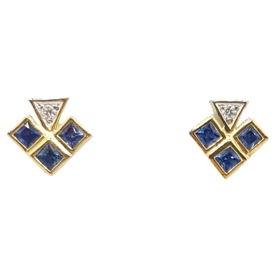 Orecchini con zaffiro blu e diamante con montatura in oro 18 carati