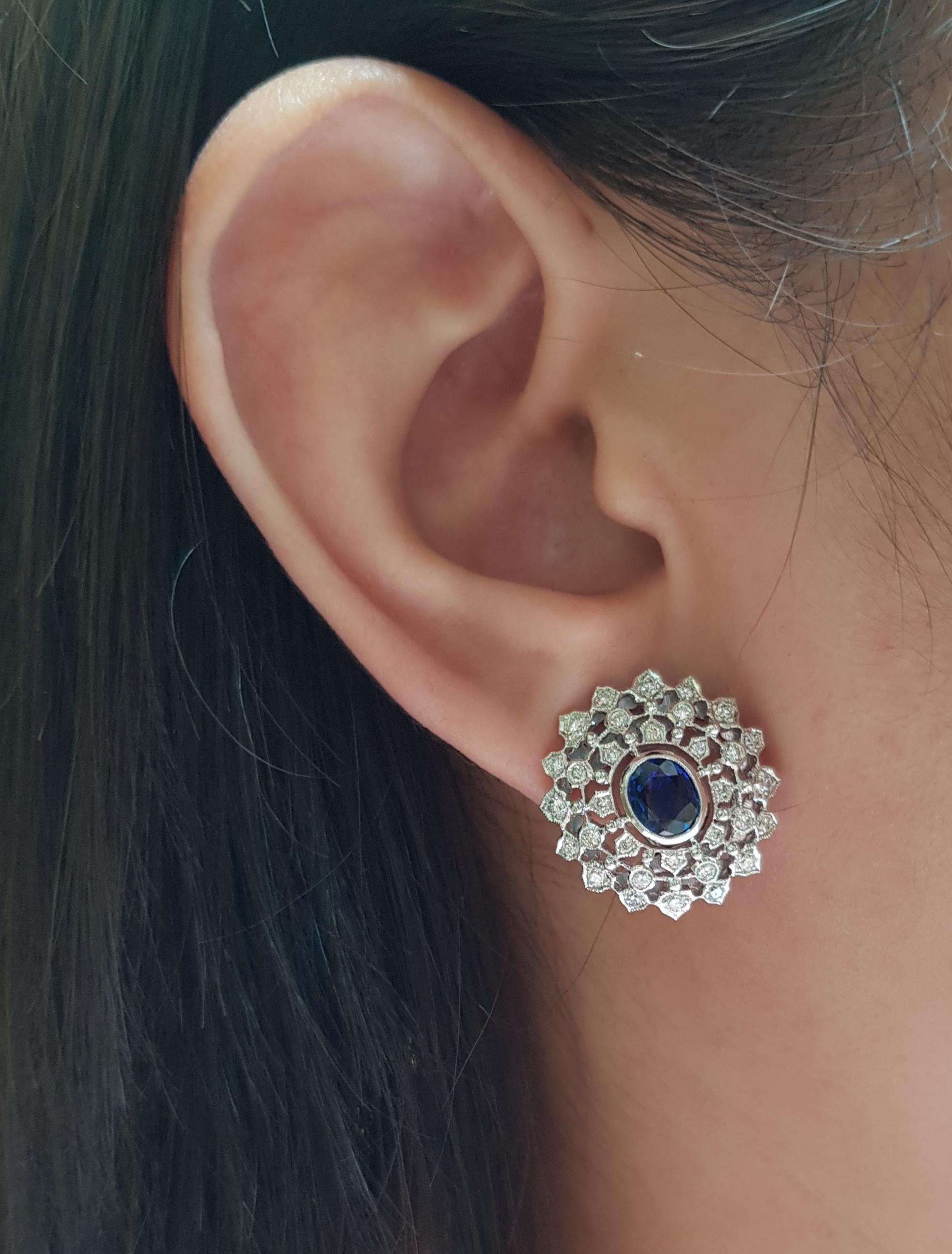 Blue Sapphire 2.39 carats with Diamond 0.97 carat Earrings set in 18 Karat White Gold Settings

Width:  2.0 cm 
Length: 2.0 cm
Total Weight: 11.24 grams

