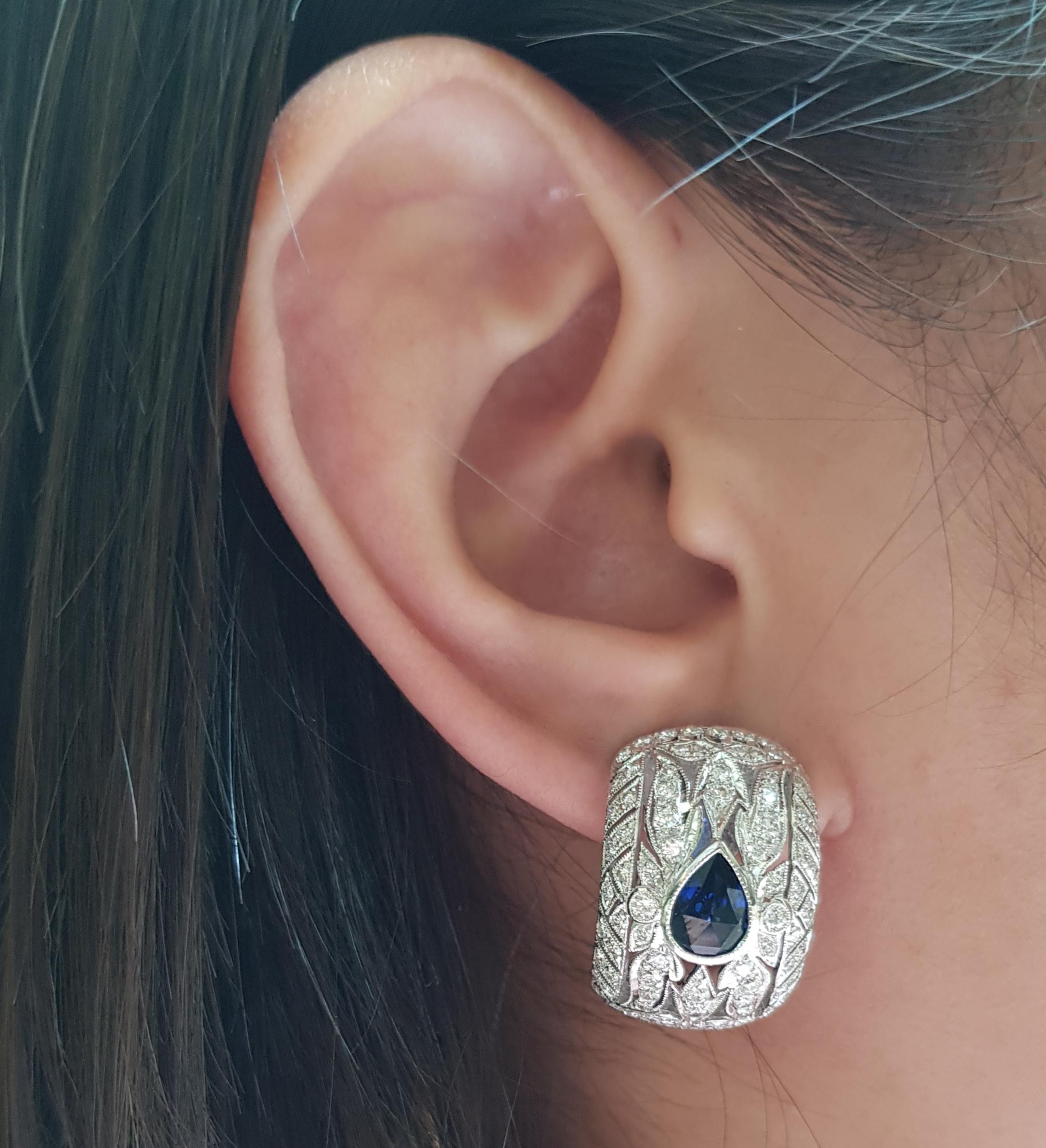 Blue Sapphire 1.87 carats With Diamond 2.20 carats Earrings set in 18 Karat White Gold Settings

Width:  01.6 cm 
Length: 2.1 cm
Total Weight: 12.63 grams

