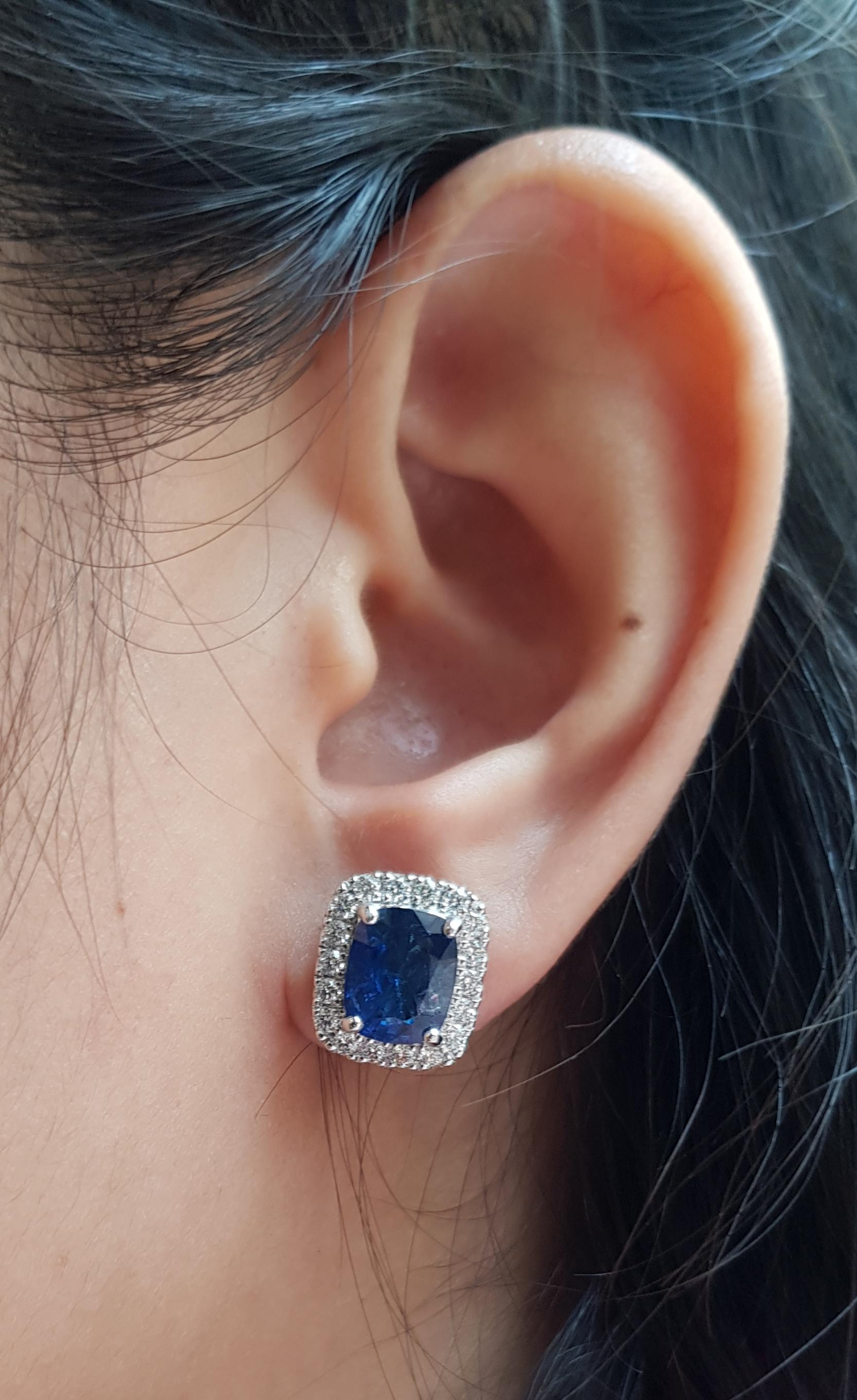 Blue Sapphire 4.56 carats with Diamond 0.72 carat Earrings set in 18 Karat White Gold Settings

Width:  1.1 cm 
Length: 1.3 cm
Total Weight: 9.82 grams

