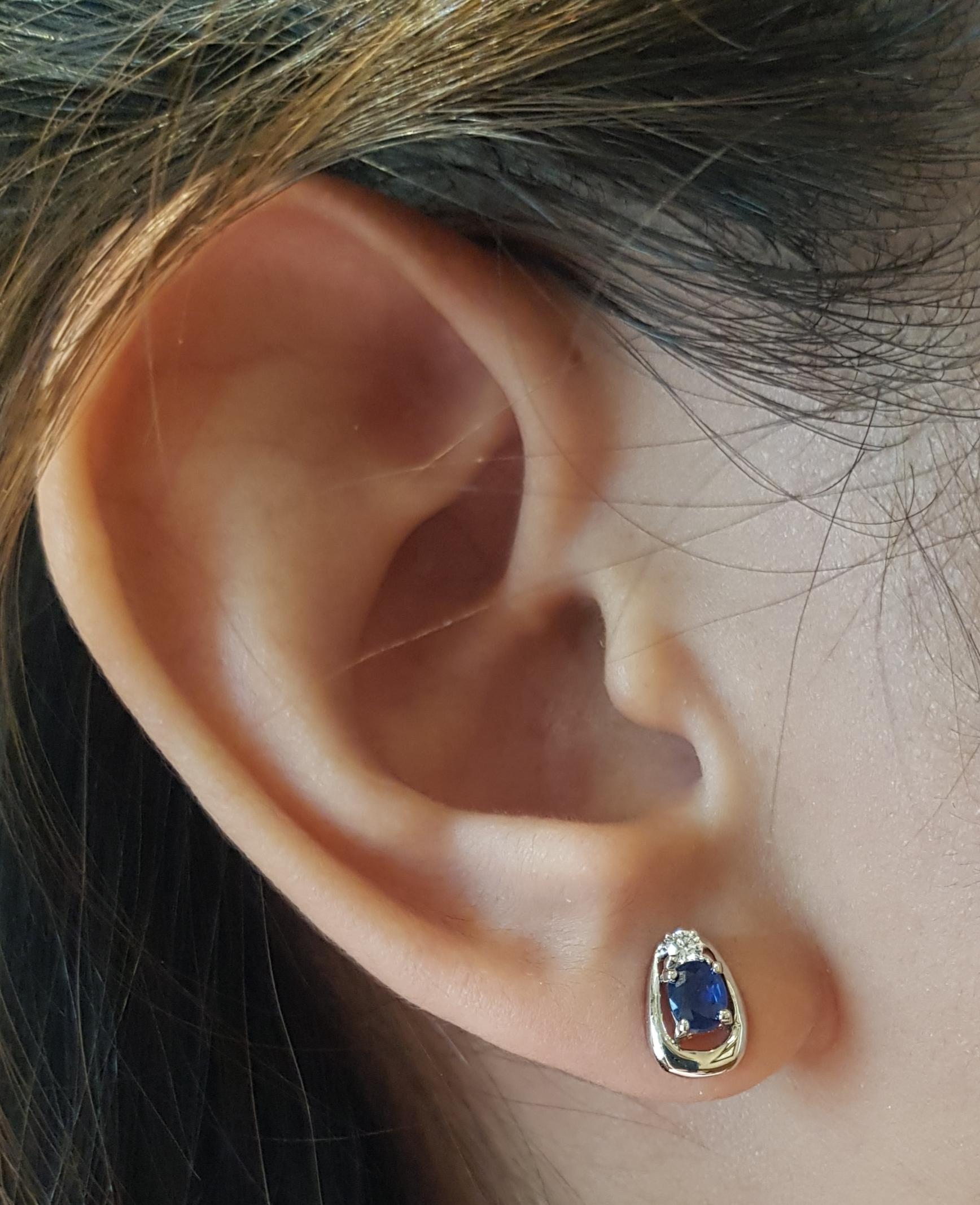 Blue Sapphire 0.64 carat with Diamond 0.08 carat Earrings set in 18 Karat White Gold Settings

Width:  0.7 cm 
Length:  0.9 cm
Total Weight: 3.02 grams

