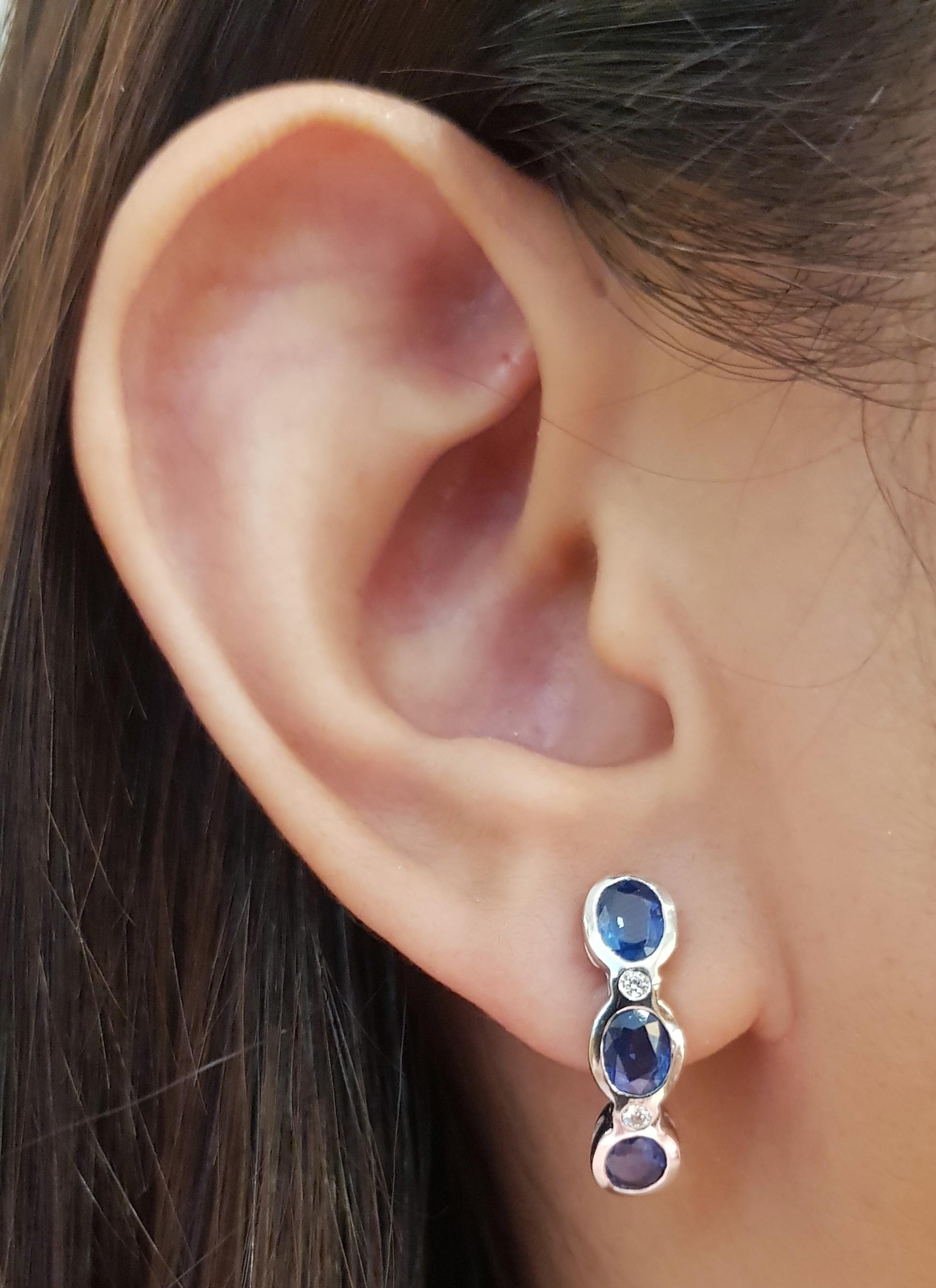 Blue Sapphire 2.75 carats with Diamond  0.08 carat Earrings set in 18 Karat White Gold Settings

Width:   0.5 cm 
Length:  2.0 cm
Total Weight: 6.24 grams

