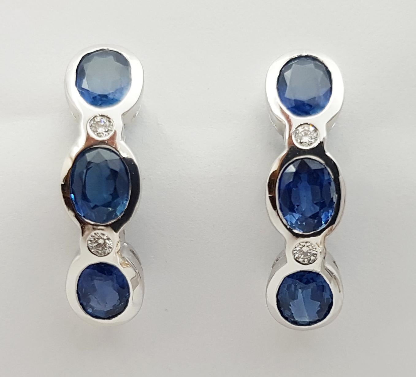 Contemporary Blue Sapphire with Diamond  Earrings set in 18 Karat White Gold Settings For Sale